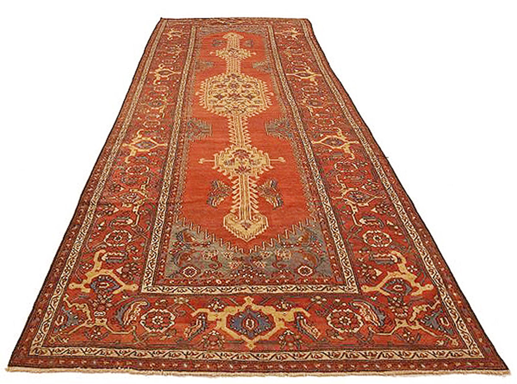 Antique Azerbaijan rug handwoven from the finest sheep’s wool and colored with all-natural vegetable dyes that are safe for humans and pets. It’s a traditional Azerbaijani design featuring mixed floral and geometric details over a deep red field. It