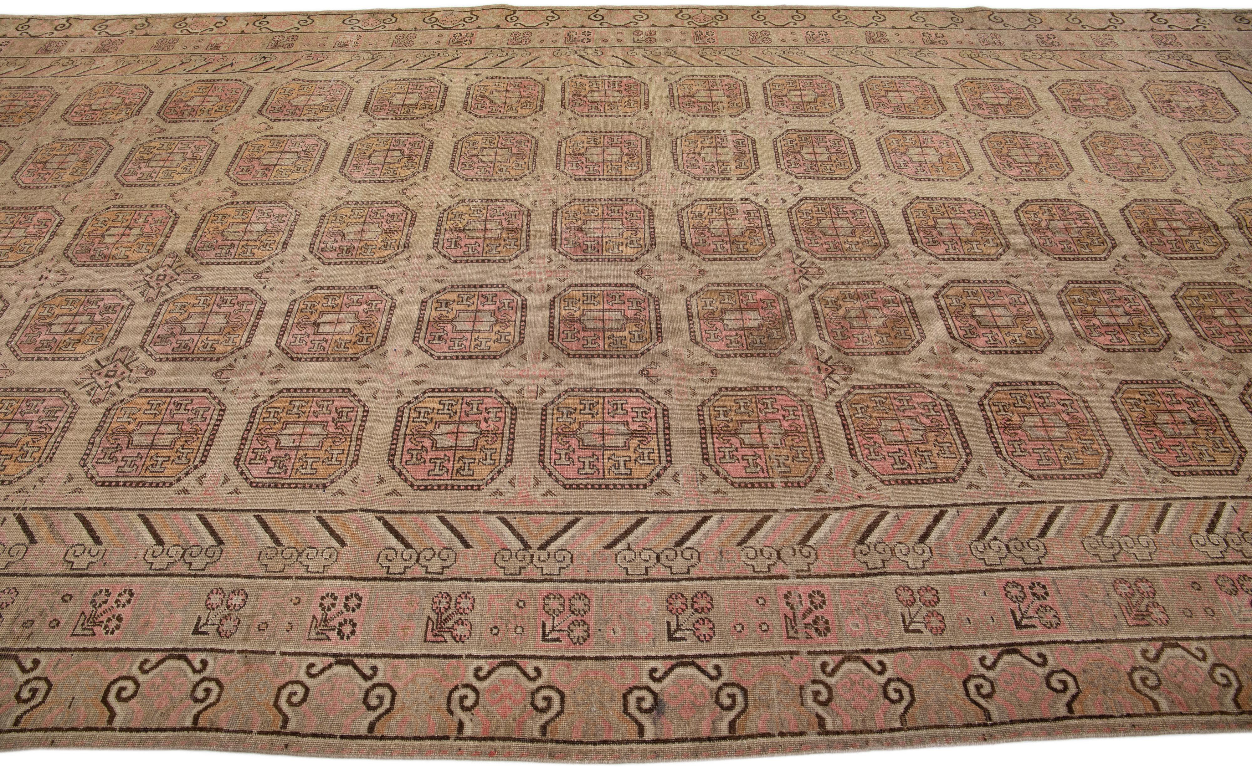 1900s Antique Brown Handmade Khotan Wool Rug with Geometric Pattern In Good Condition For Sale In Norwalk, CT