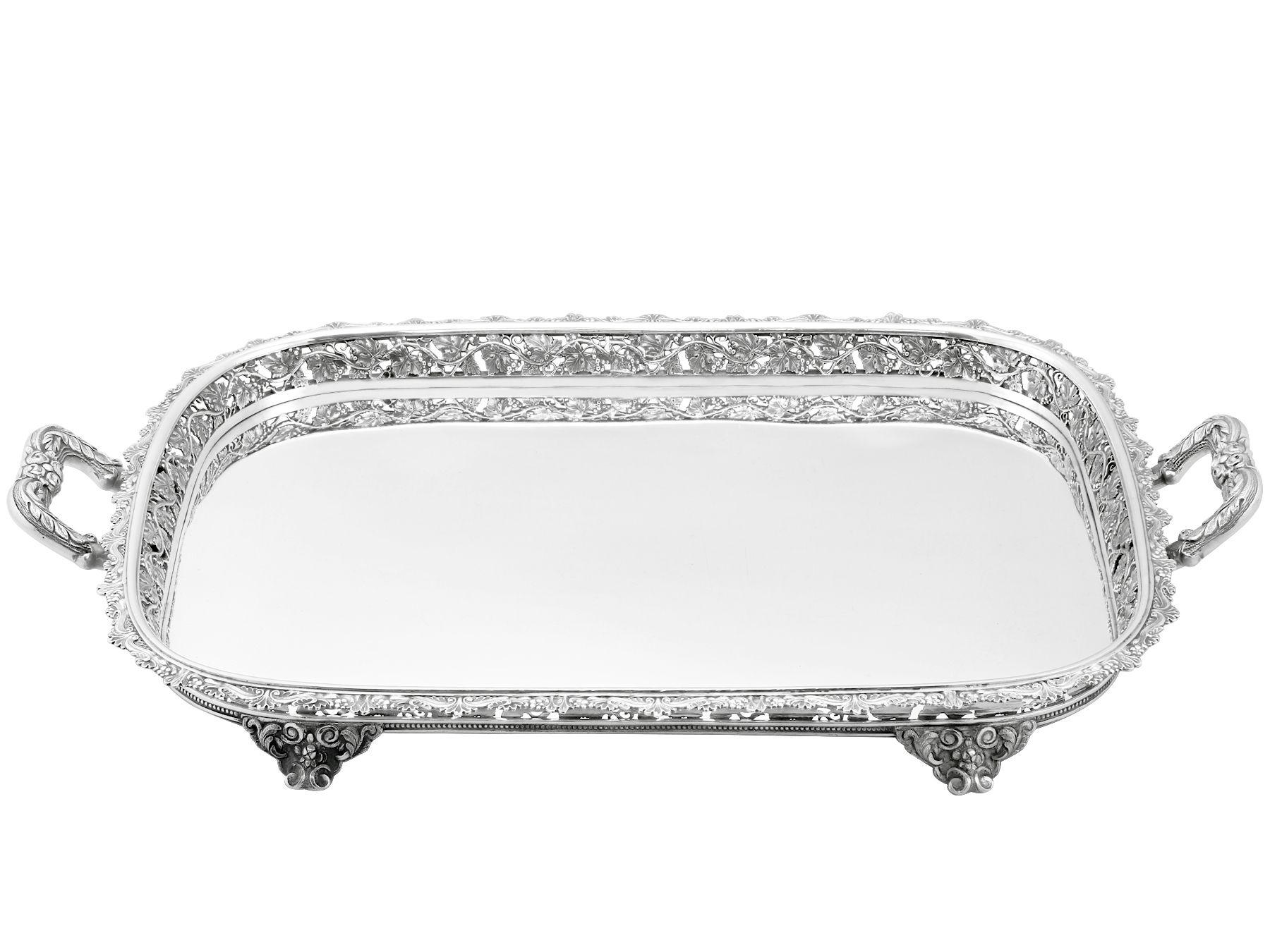 An exceptional, fine and impressive, antique European silver tea tray; an addition to our silverware collection.

This exceptional antique silver tray has a rectangular rounded form.

The surface of this antique tray is plain and