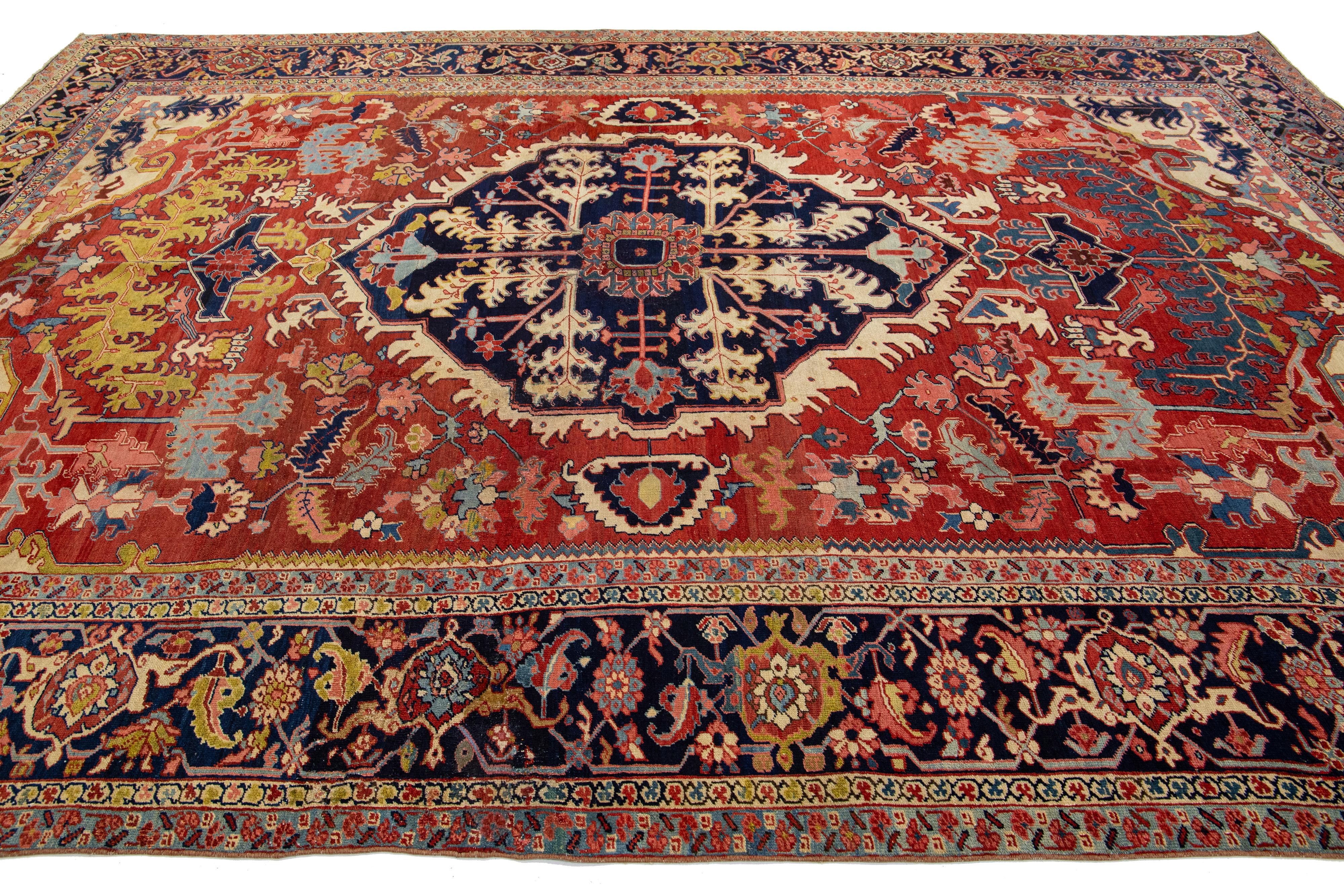 1900s Antique Handmade Wool Rug Persian Heriz Featuring a Medallion Motif  In Good Condition For Sale In Norwalk, CT