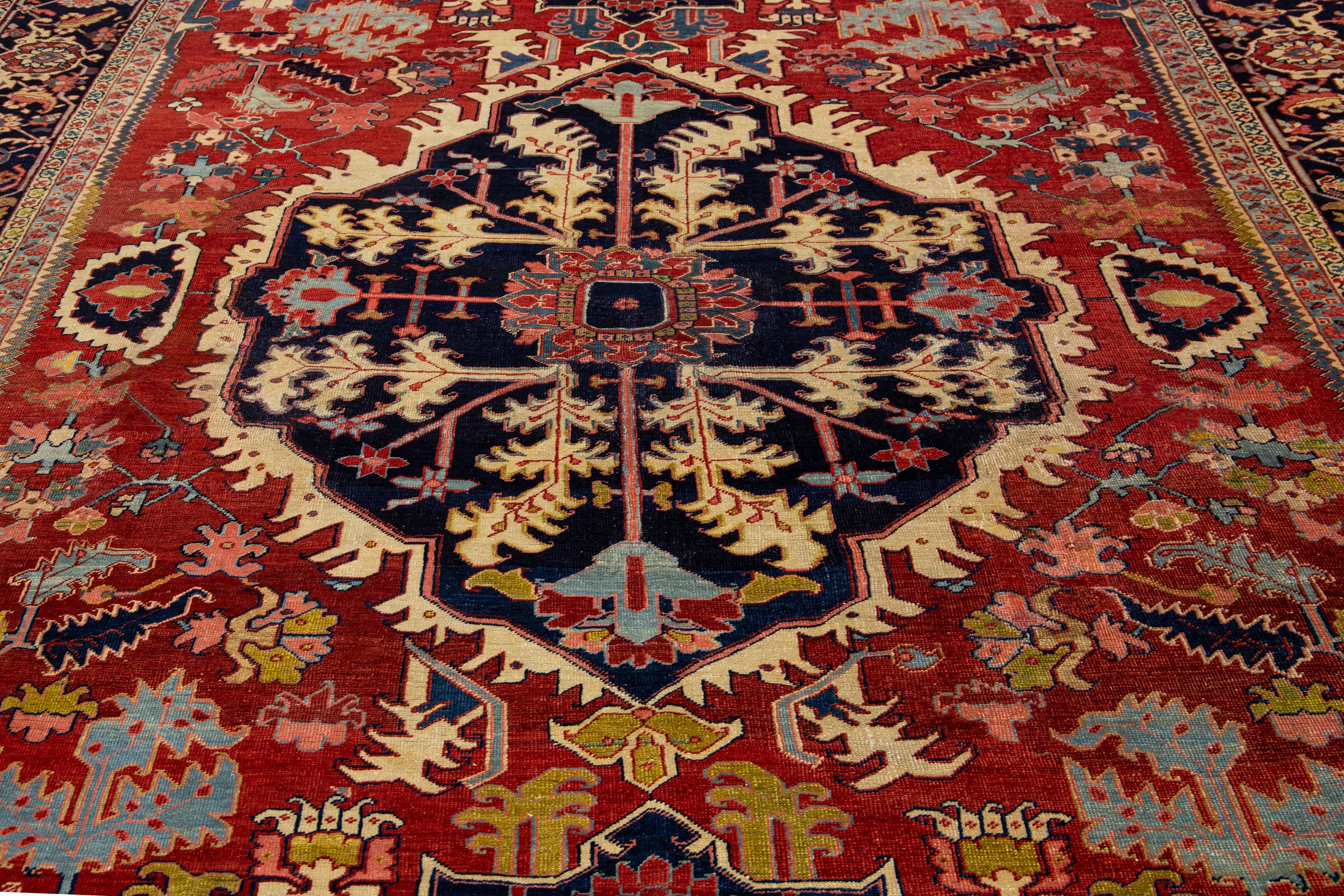 1900s Antique Handmade Wool Rug Persian Heriz Featuring a Medallion Motif  For Sale 1