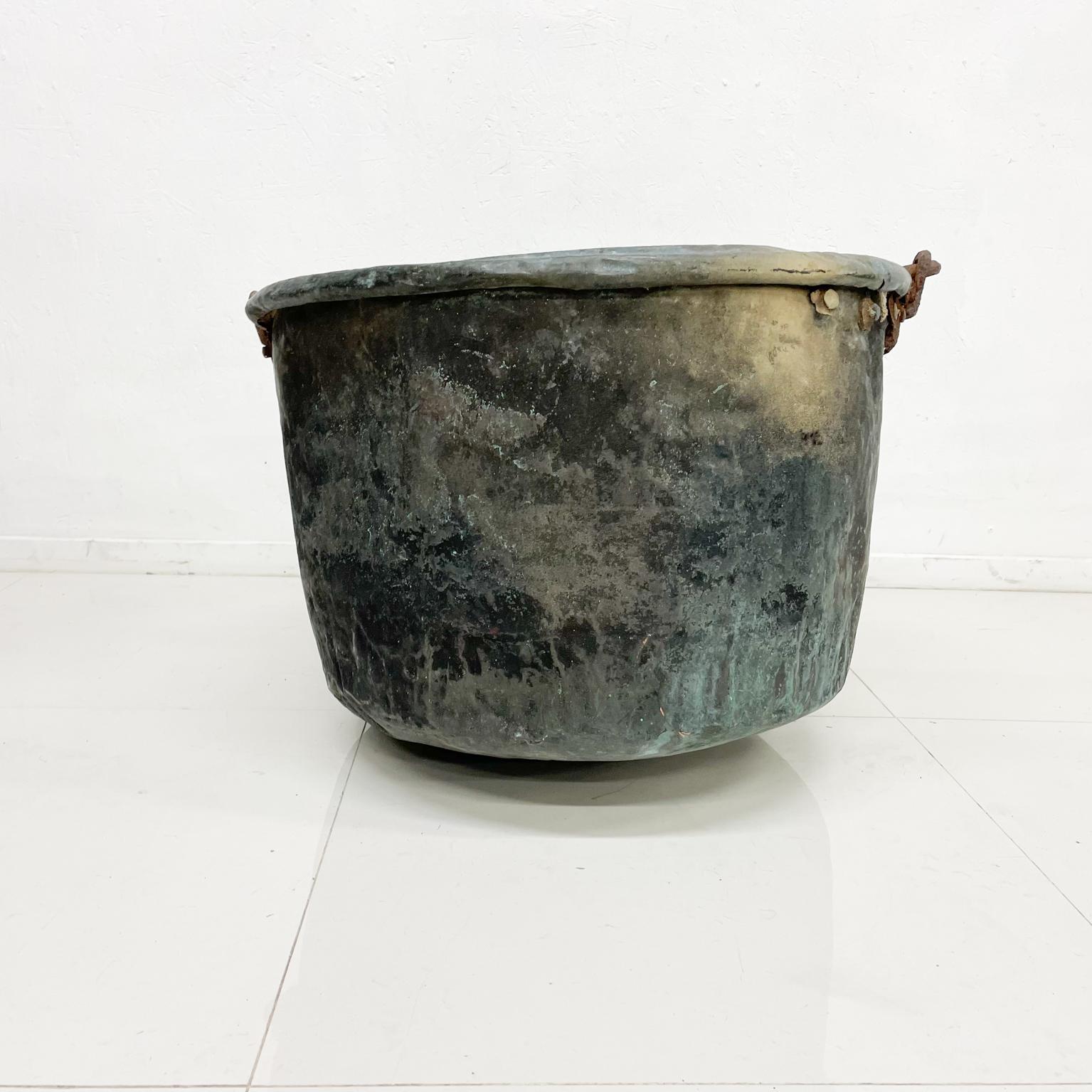Circa 1900s Old Copper Bucket Tub with forged iron handle.
Perforated detailing.
Patinated fair condition.
Bends, dings + fabulous charm.
26 diameter 19.5 height, 30.5 height with handles
Unrestored Vintage Antique presentation and condition.
Refer