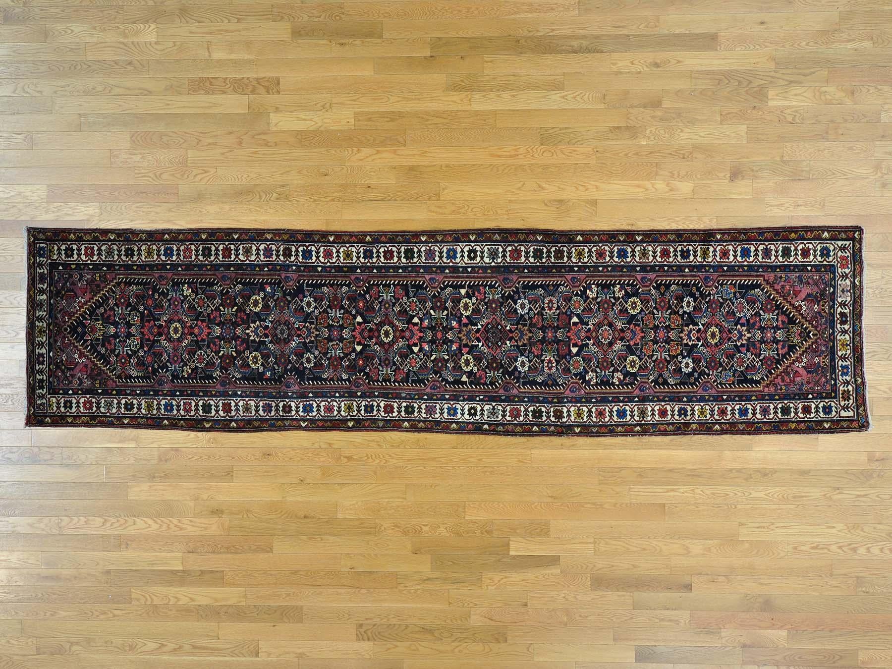 Bring life to your home with this admirable antique carpet. This handcrafted Persian Bakhtiari excellent condition, is an authentic runner size oriental rug. This rare piece has been built for months and months in the centuries old traditional