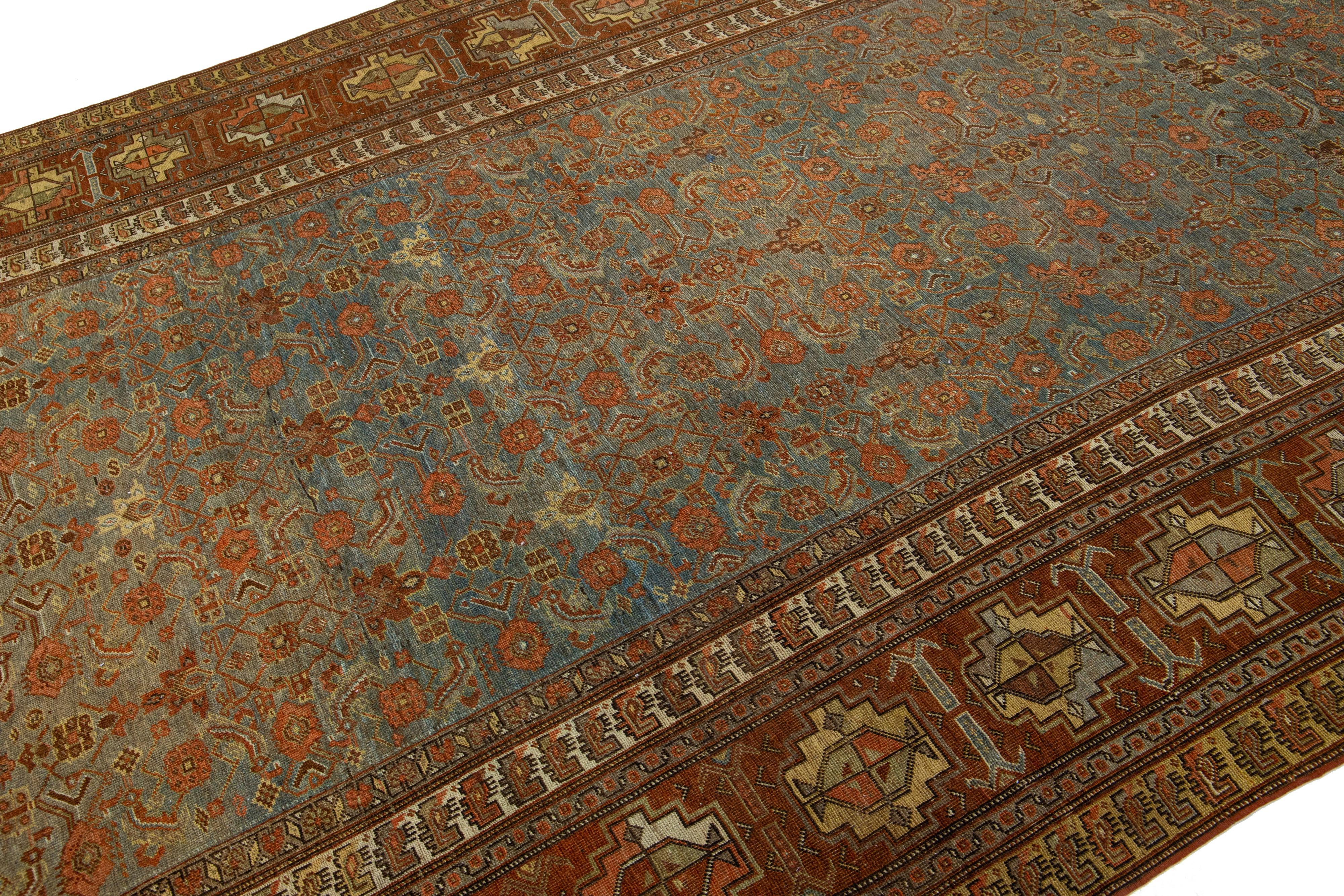 Islamic 1900s Antique Persian Bidjar Wool Runner in Blue With Allover Floral Motif For Sale