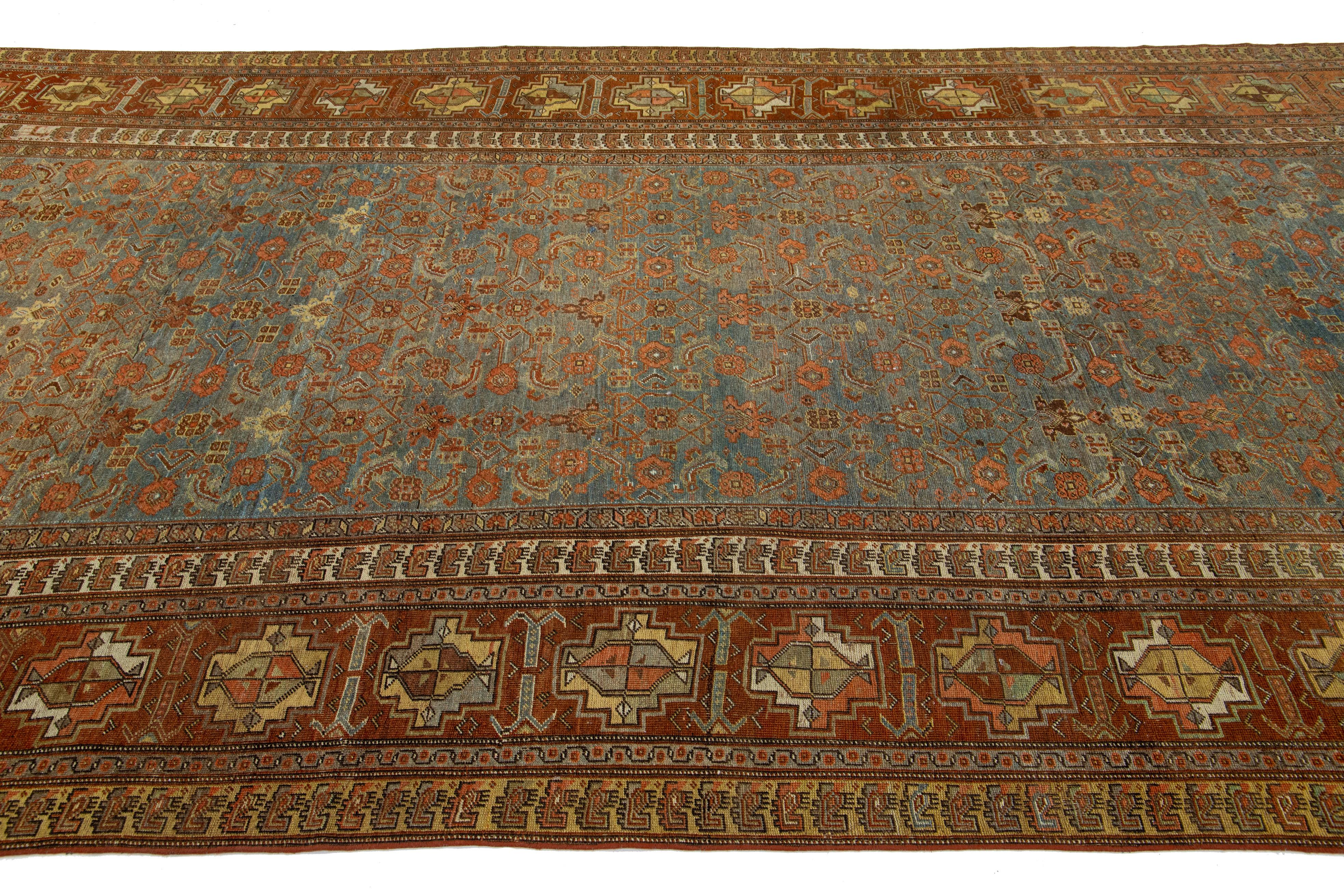 Hand-Knotted 1900s Antique Persian Bidjar Wool Runner in Blue With Allover Floral Motif For Sale