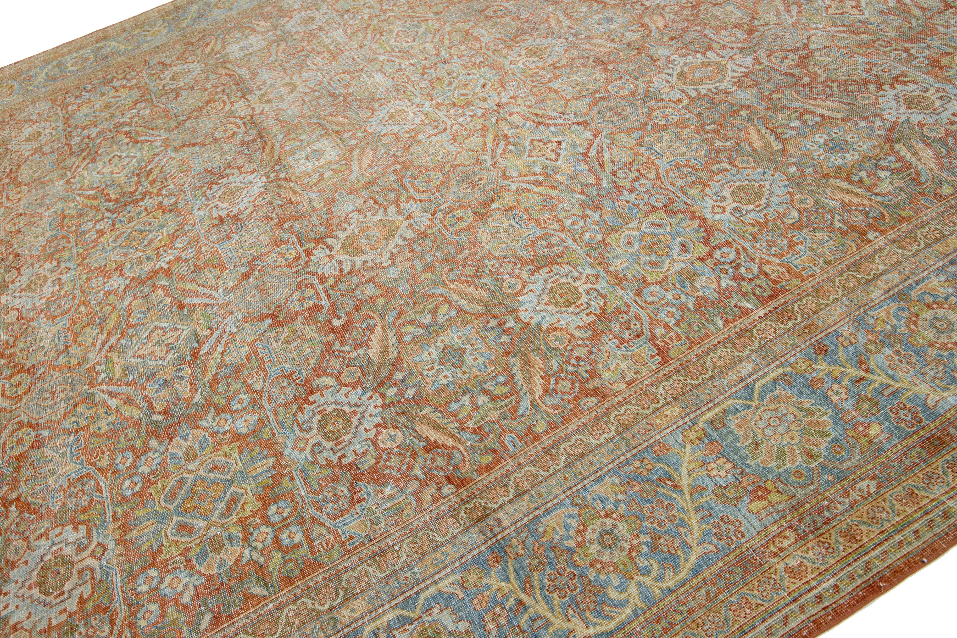 Islamic 1900s Antique Persian Mahal Rust Wool Rug With Allover Floral Pattern For Sale