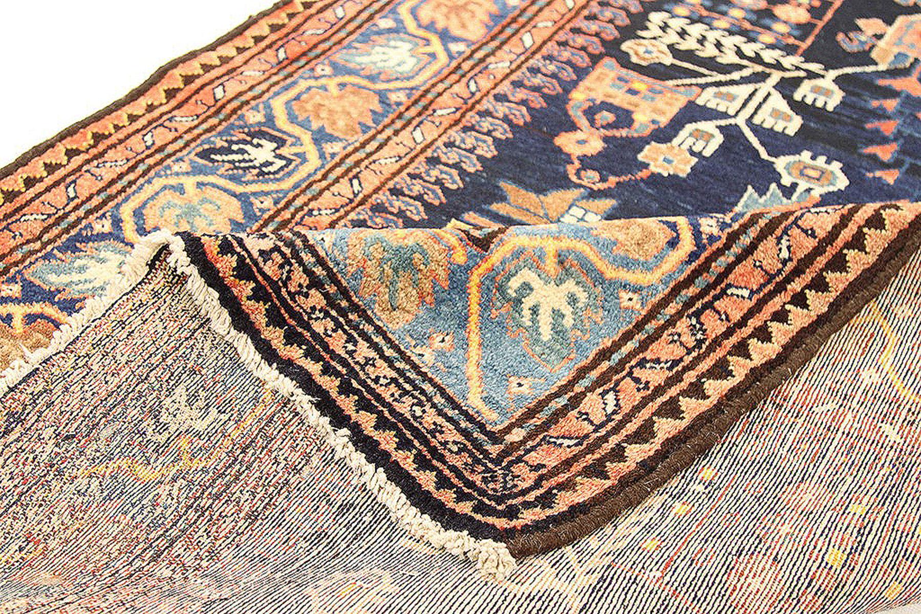 Antique Persian runner rug handwoven from the finest sheep’s wool and colored with all-natural vegetable dyes that are safe for humans and pets. It’s a traditional Malayer design featuring a mixed brown, blue, orange, and white combination of floral