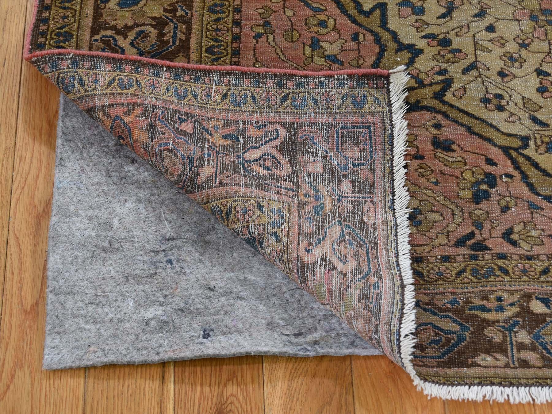 This is a genuine hand knotted oriental rug. It is not Hand Tufted or Machine Made rug. Our entire inventory is made of either hand knotted or handwoven Rugs.

Revive your home style with this beautiful antique carpet. This handcrafted antique