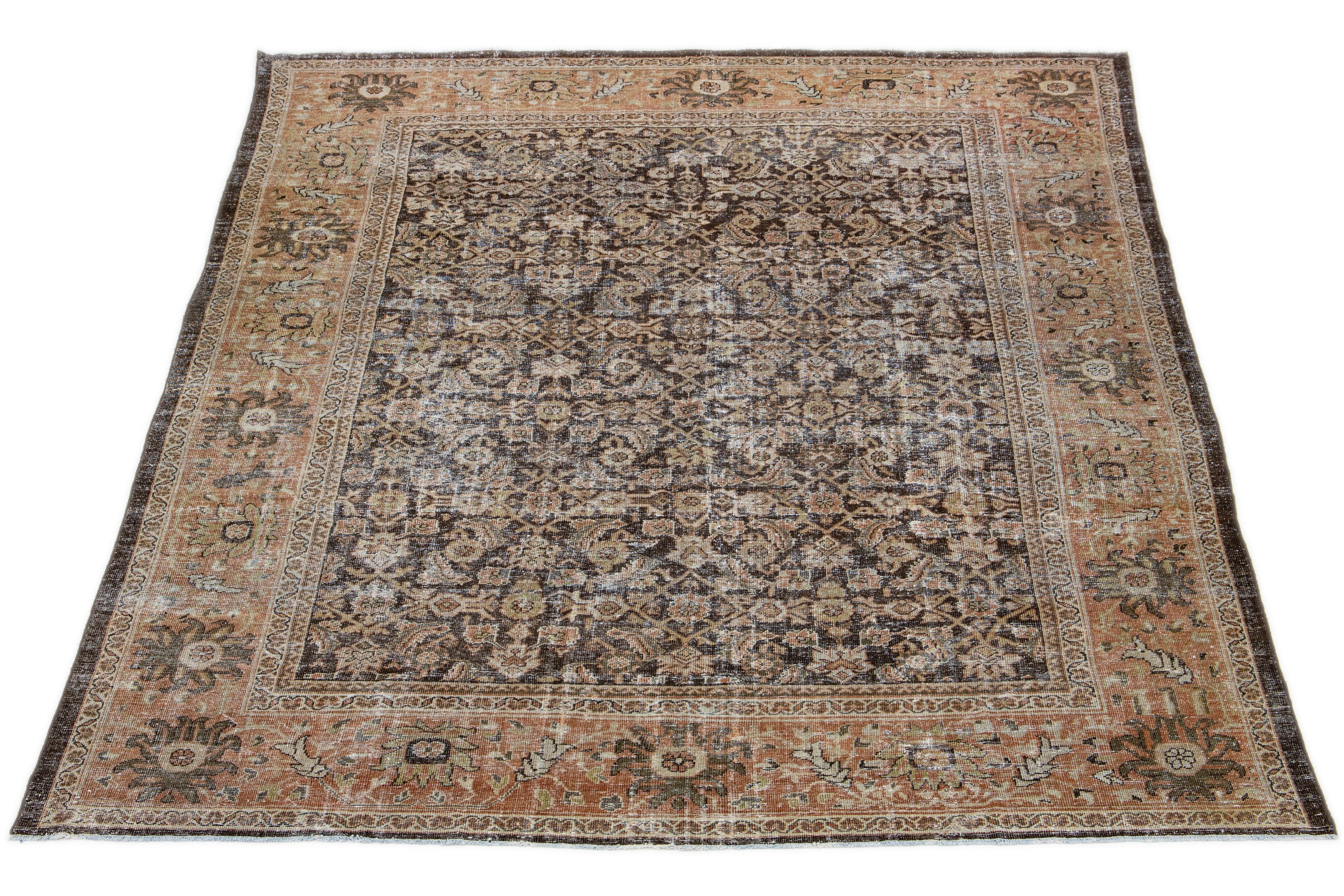 This antique Sultanabad wool rug, which dates back to the 1900s, is skillfully hand-knotted. It displays a brown field with captivating allover patterns in yellow, beige, and rust accents.

This rug measures 10'1