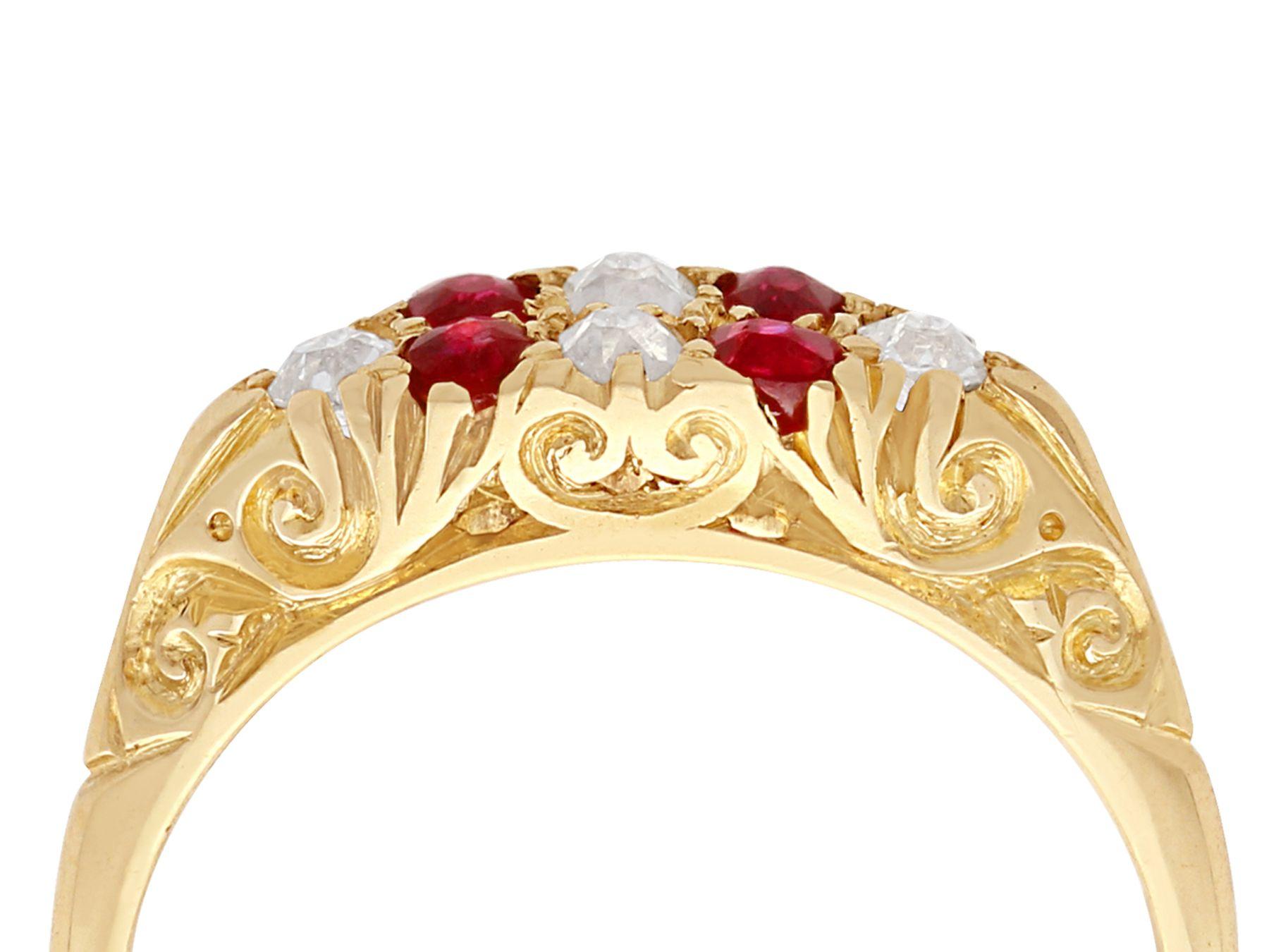 A fine and impressive antique 0.16 carat natural ruby and 0.15 carat diamond, 18 karat yellow gold cocktail ring; part of our antique jewelry and estate jewelry collections.

This fine and impressive antique ruby ring has been crafted in 18k yellow