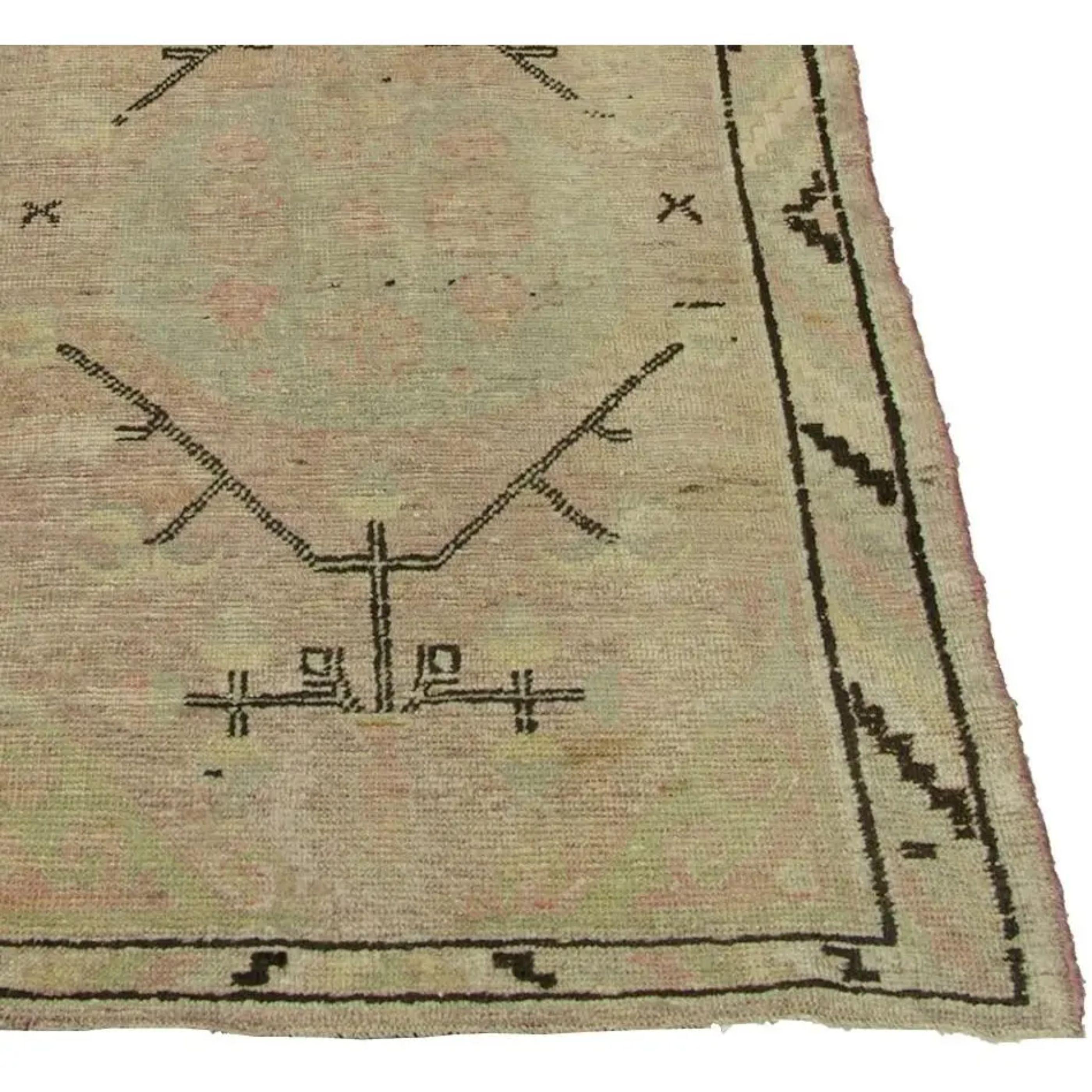 Up for sale is an antique Samakhand rug. This is an Uzbek tribal design rug with a lighter pink throughout the rug.  

