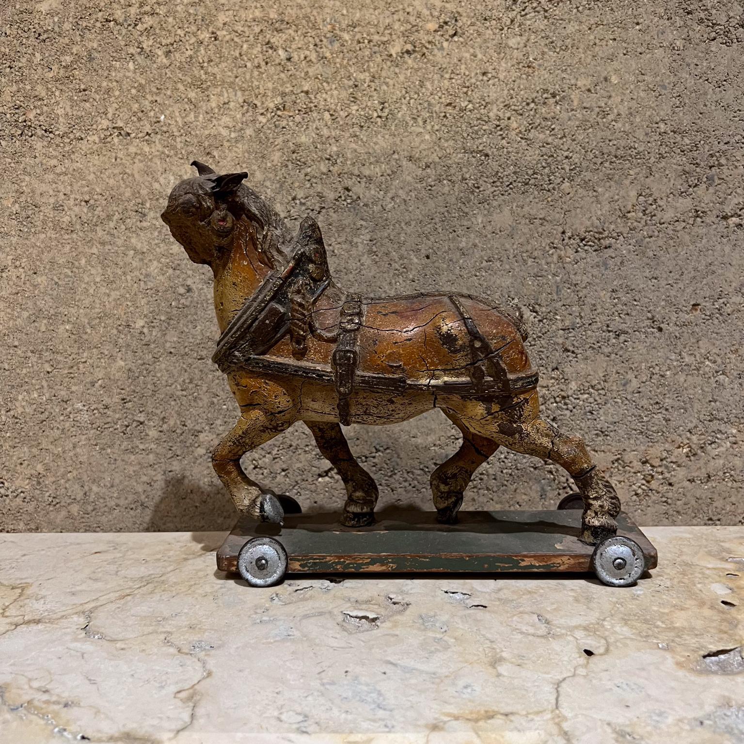 1900s Antique Terracotta Majestic Horse on Wheeled Platform 
San Luis Potosí Mexico
Collectible Toy Sculpture
 8 H x 8.5 W x 3 d
Terracotta horse. Mounted on wood base with wheels.
Wonderful old toy, original patina. 
Missing some pieces,