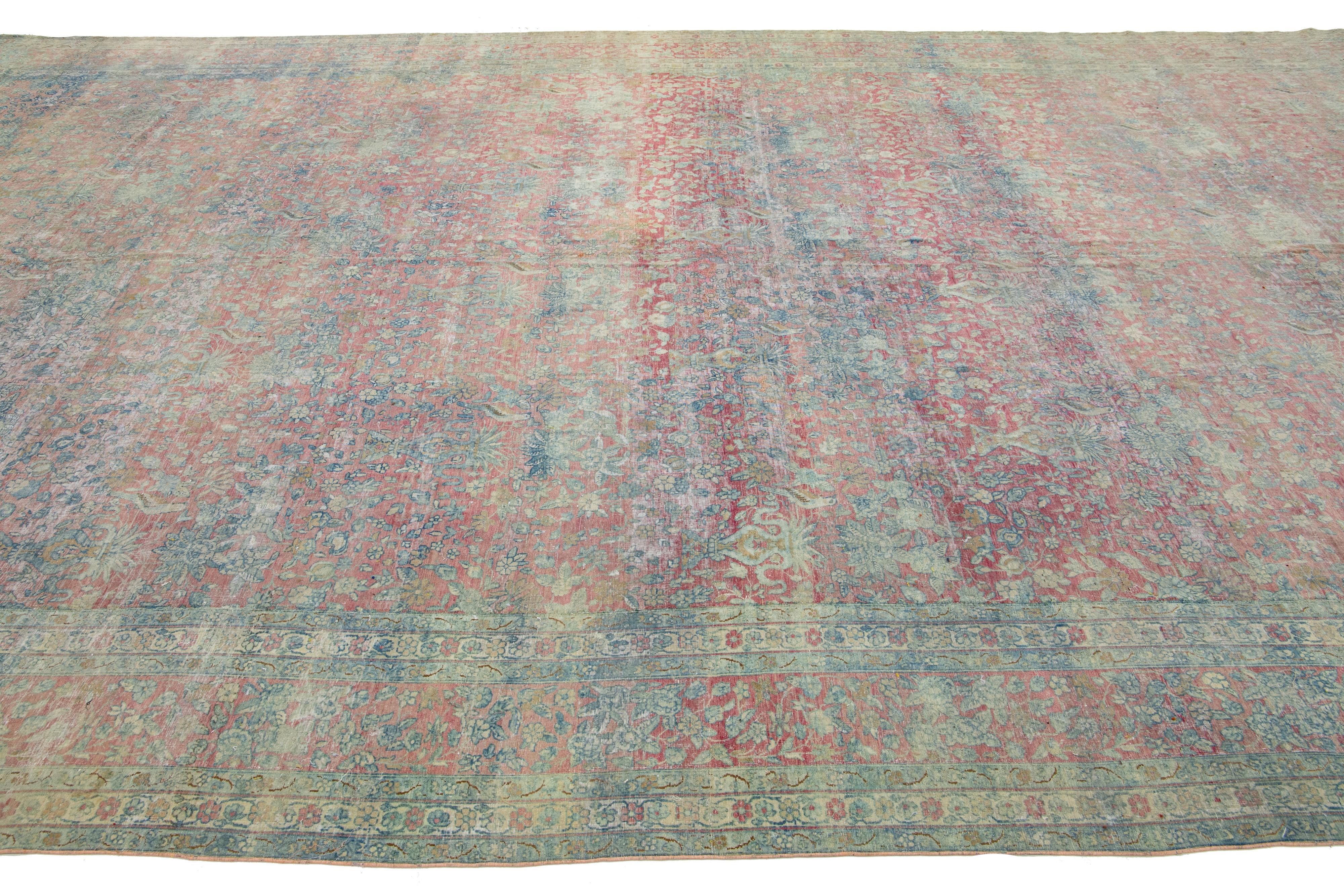 Hand-Knotted 1900s Antique Wool Rug Persian Kerman featuring an Allover Floral Design For Sale