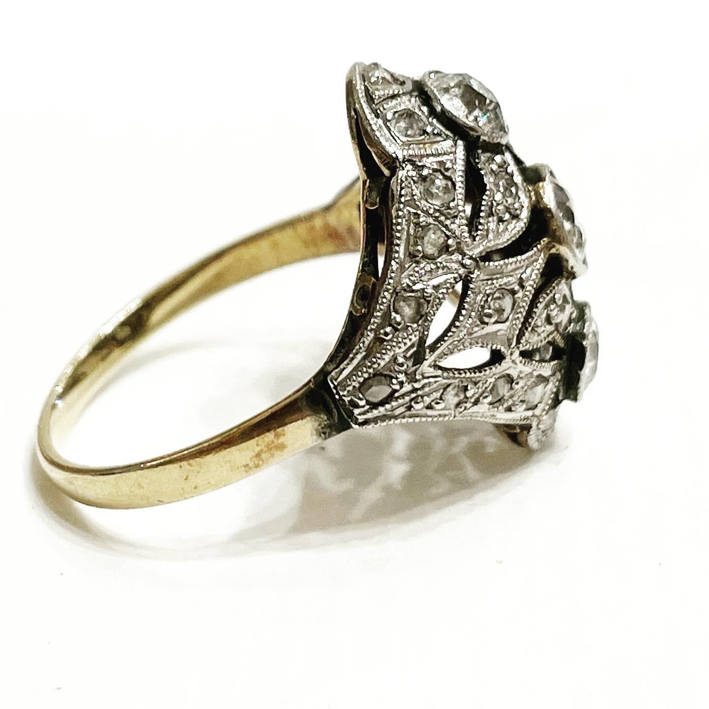Unique and exquisite Art Nouveau Style.
1900s diamond three stones ring crafted in 18kt yellow gold topped with platinum, This piece features 3 old European Cut diamonds nestled together at the center, 
A gorgeous design, it could make a unique