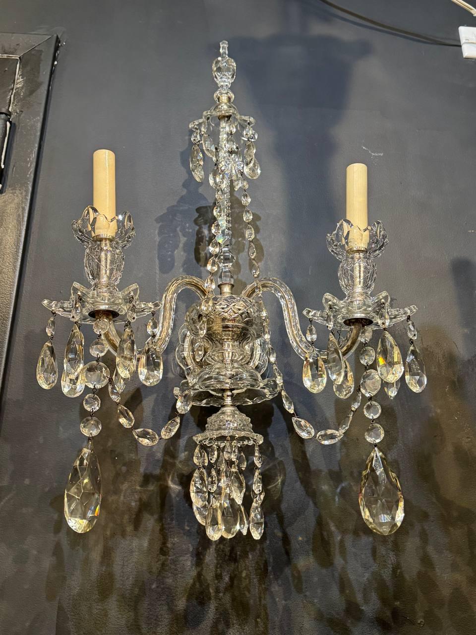 A beautiful pair of circa 1900 Baccarat crystal sconces with crystal hangings