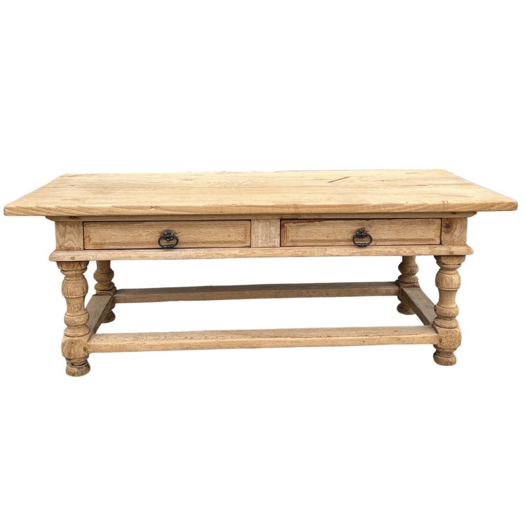 Circa 1900s Belgium

This antique Belgian oak coffee table is full of character and charm. Featuring turned legs, hand-carved details throughout, two drawers and a bleached finish, this table would be a lovely addition to any living room.