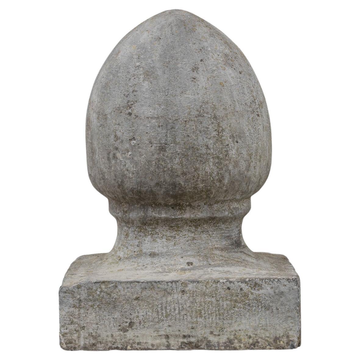 This 1900s Belgian Bluestone Decoration exemplifies early 20th-century European craftsmanship, carved from dense natural bluestone with a soft, time-weathered patina. Its sculptural form—simple yet architectural—suggests it may have once served as a