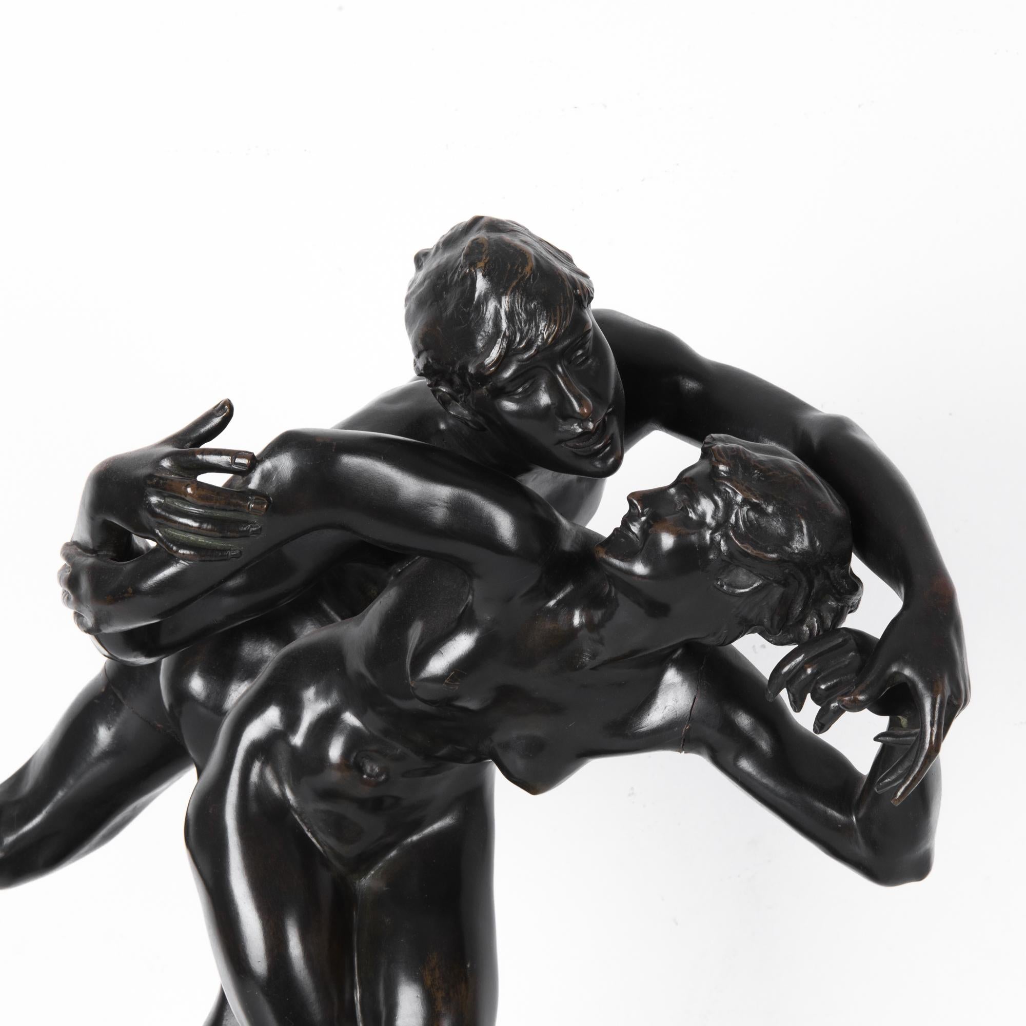A figurative bronze sculpture by J. Lambeux from turn of the century, Belgium. A man and a woman whirl in a dynamic, mobile gesture. A rich and evocative finish, the bronze is so dark it is almost black. The glossy polish emphasizes the elegant