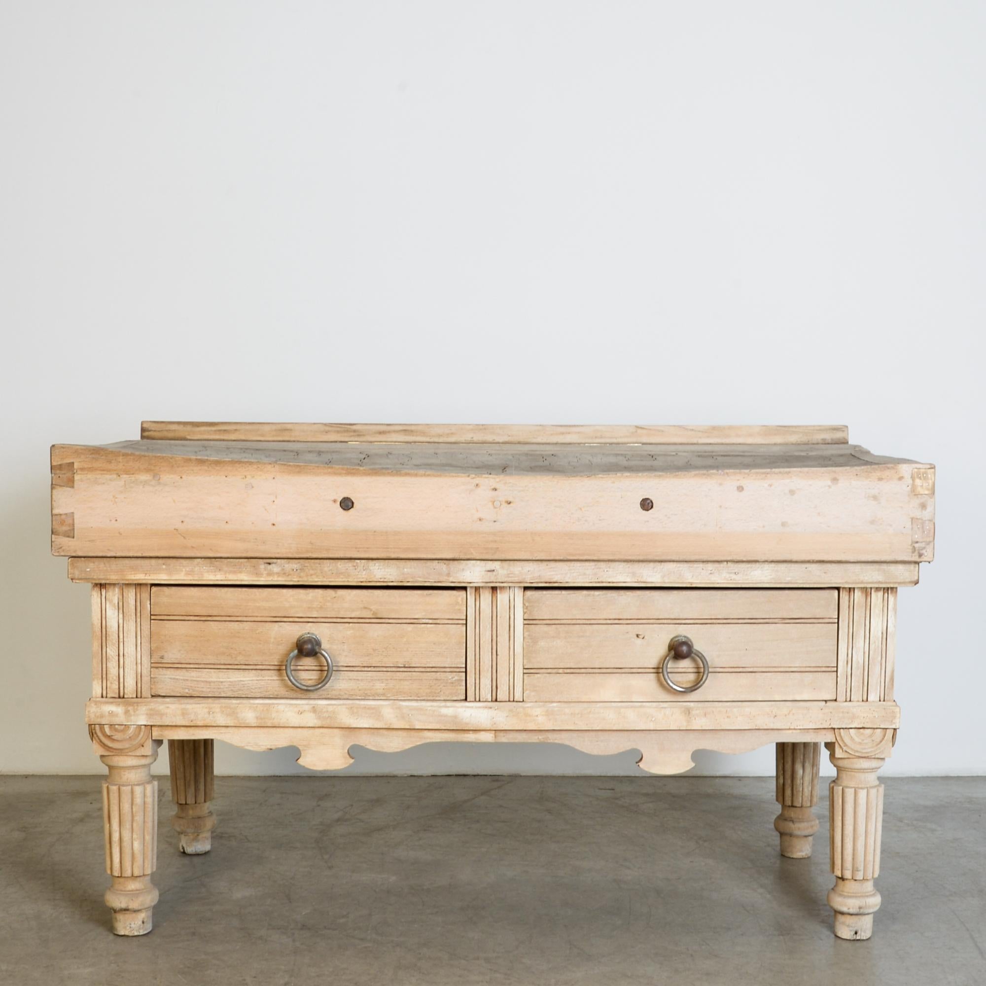 Ornate butcher block table from circa 1900, Belgium. This large scale butcher’s block is supported by handsome curved legs, the ornament of an era gone by. With wonderful architectural style moulding details and original hardware, this table has