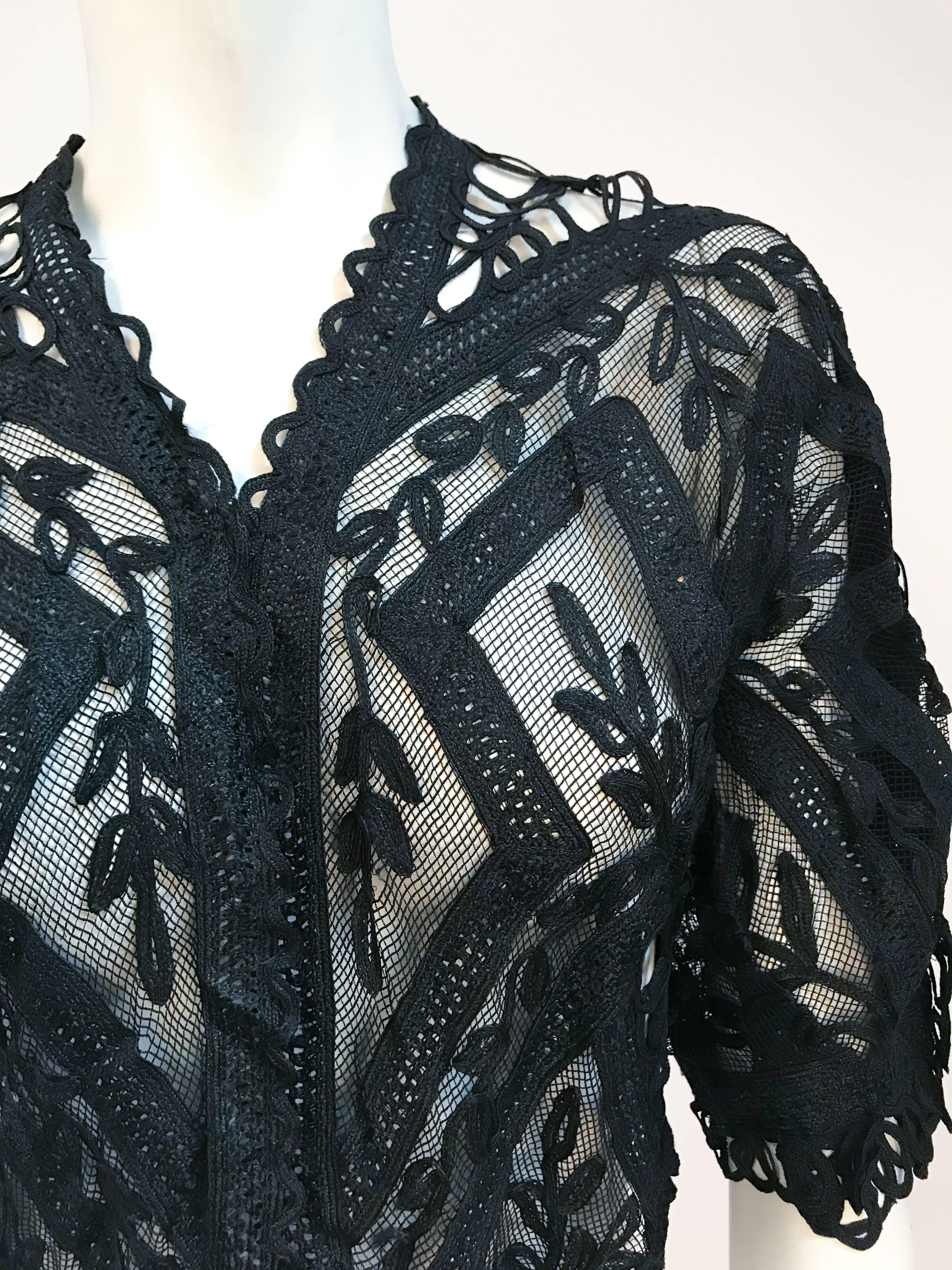 1900s Black Lace Mesh Bolero. Mesh base with lace detailing, hook and eye closures at front. 