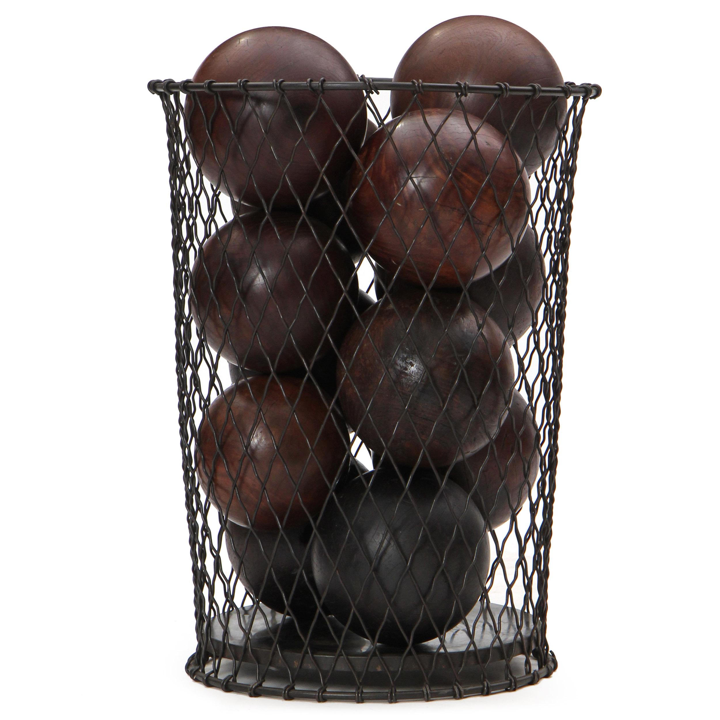 A vintage black patina waste basket well-formed of solid steel wire and woven in a diamond pattern. Filled with 12 lignum vitae bowling balls. Manufactured in the 1920s.