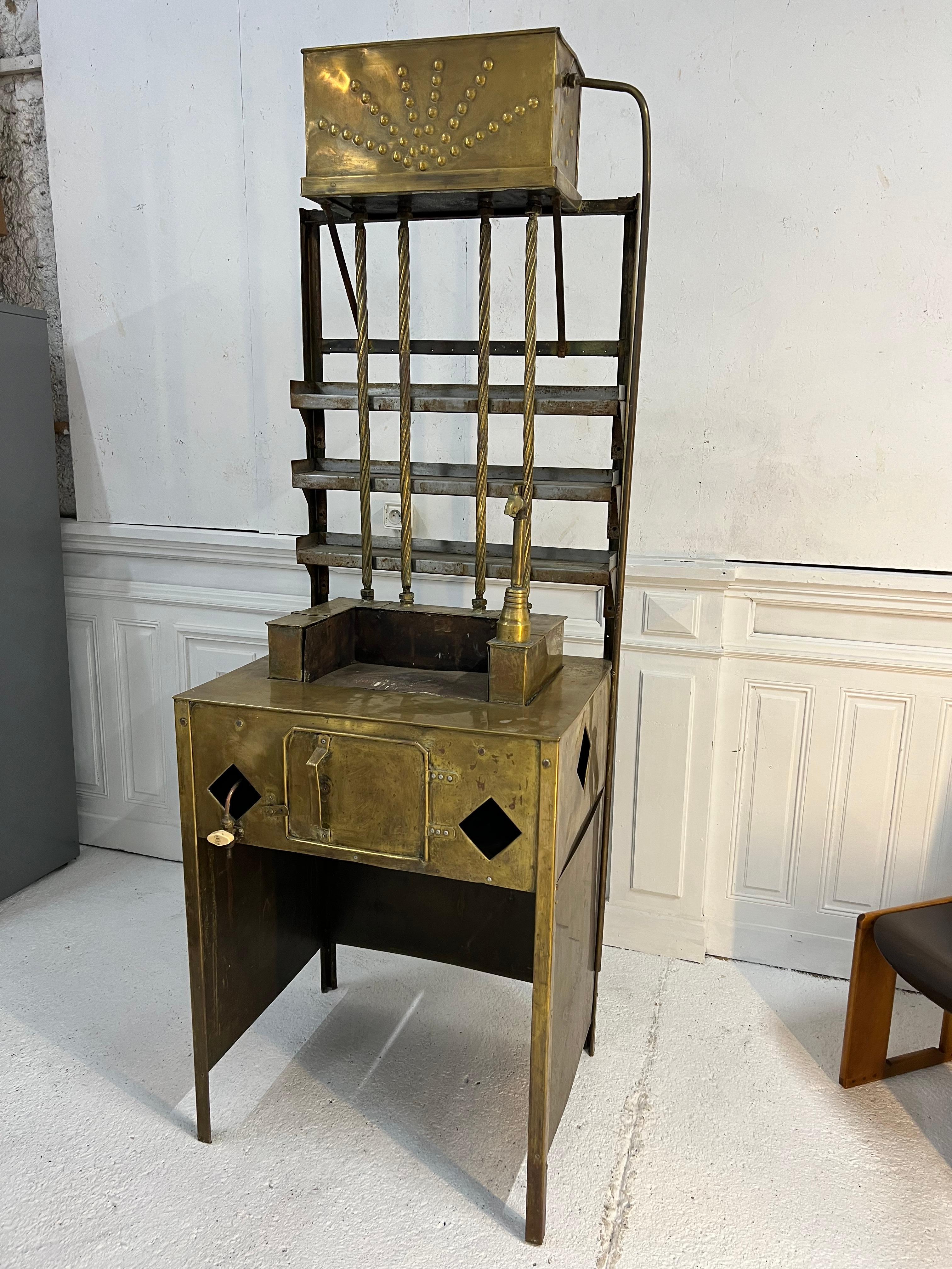 1900's brass tea cabinet
this kind of furniture was installed in cafes see the storefronts and offer the sale of tea to take away
it will be very elegant in professional or personal decoration.