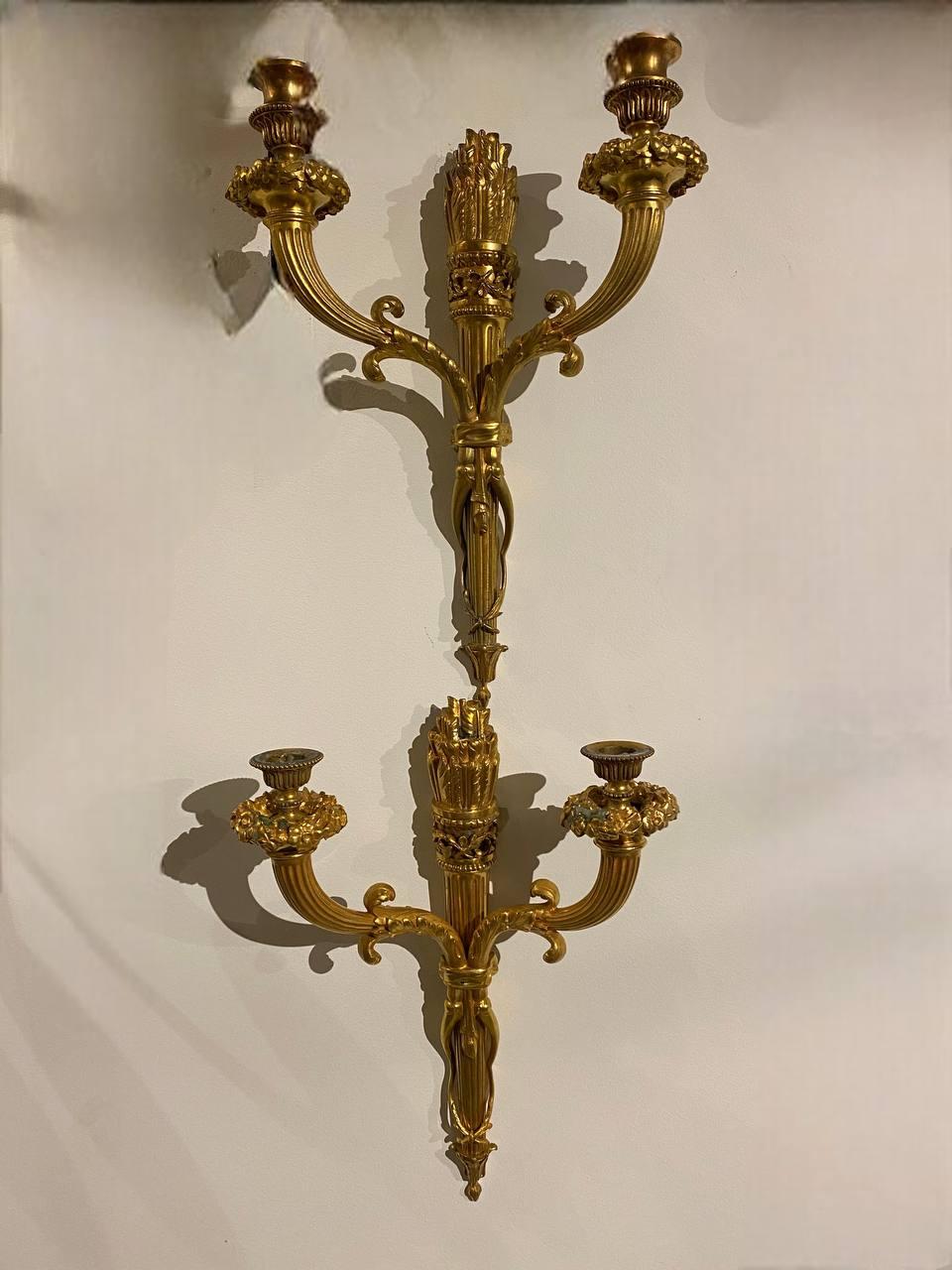A pair of 1900 gilt bronze Caldwell sconces with two lights