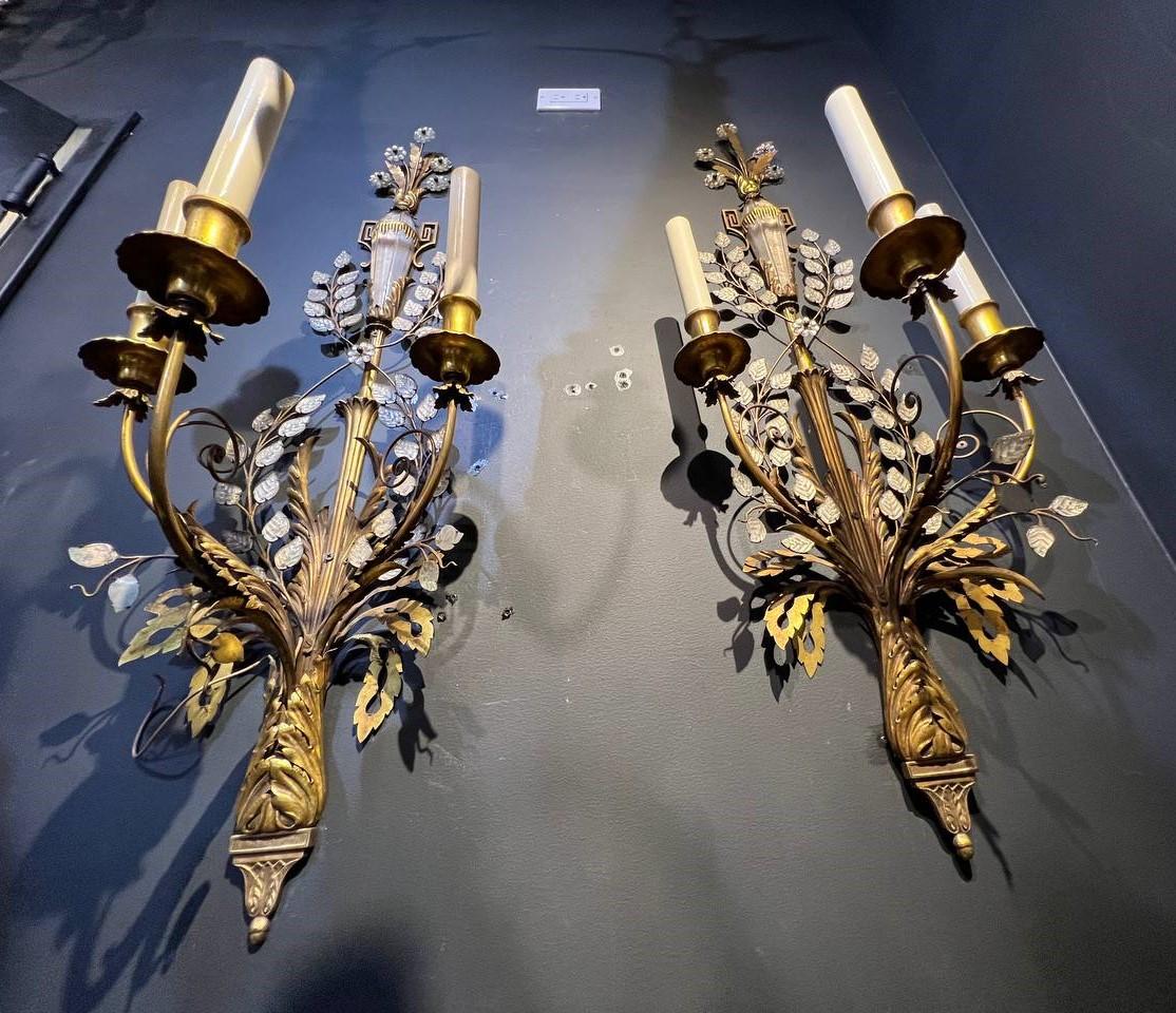 A circa 1900's large Caldwell sconces with 3 lights, glass leaves and crystal urn body on top 