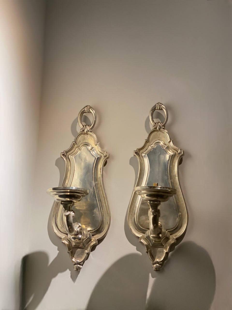 A pair of Caldwell silver plated one light sconces 