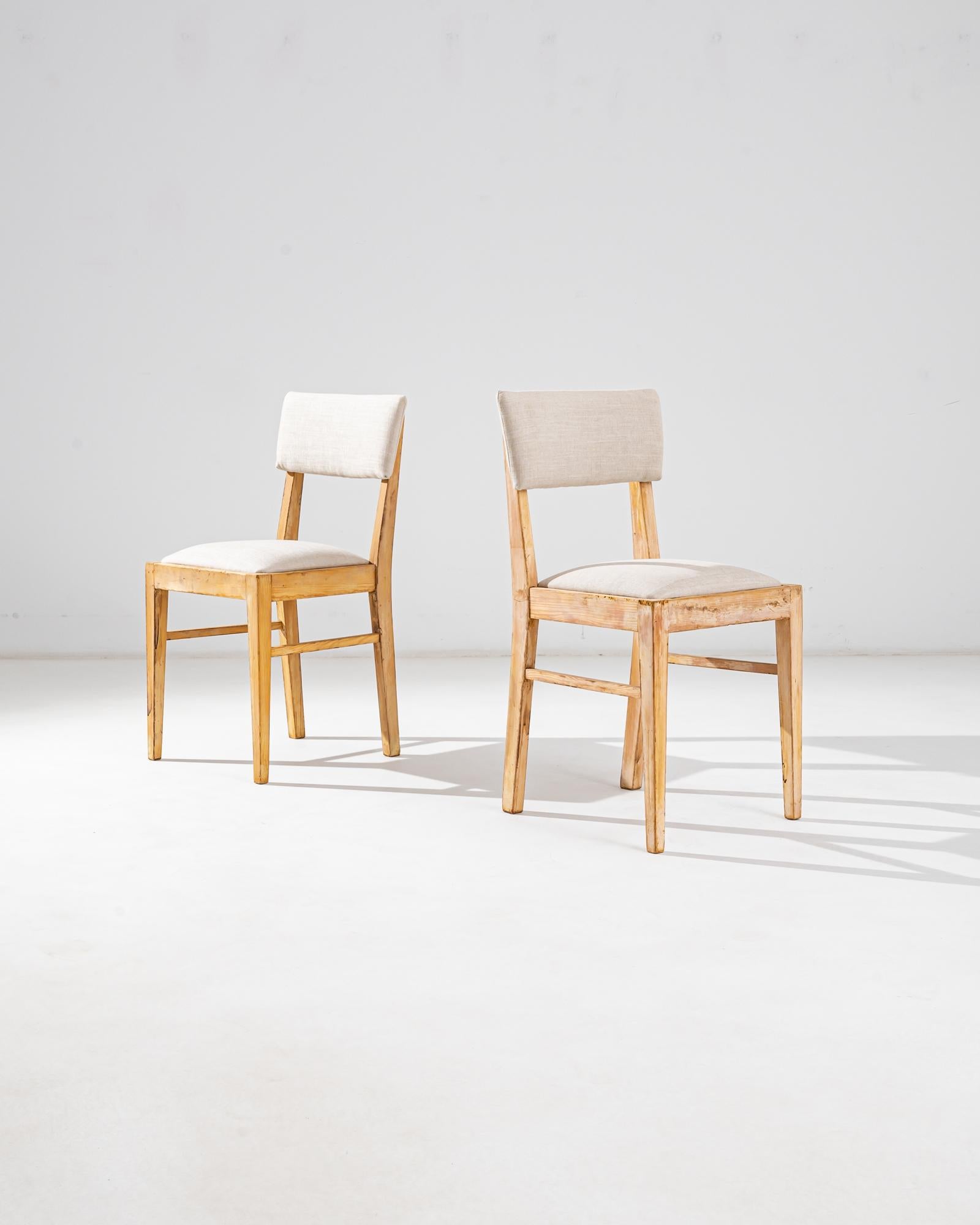 Uncover the allure of vintage charm with this exquisite pair of 1900s Central European Wooden Chairs. Each chair stands as a relic of a time when craftsmanship was an art, featuring sturdy wooden frames that showcase the natural beauty of the wood