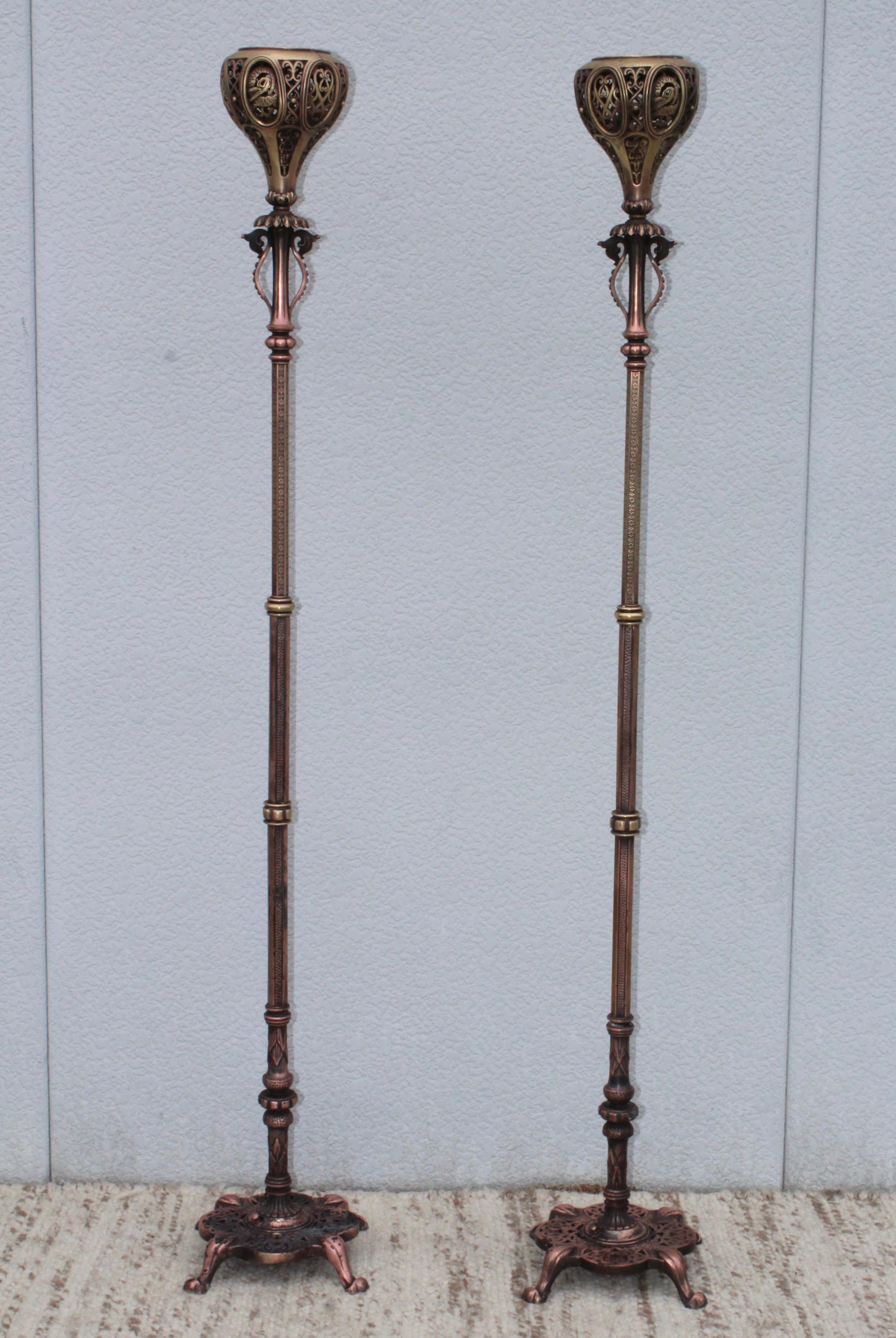 A pair of 1900s Chinese cast iron, brass and bronze floor lamps, in vintage condition lightly polished with some wear and patina due to age and use. Newly rewired and ready to use.