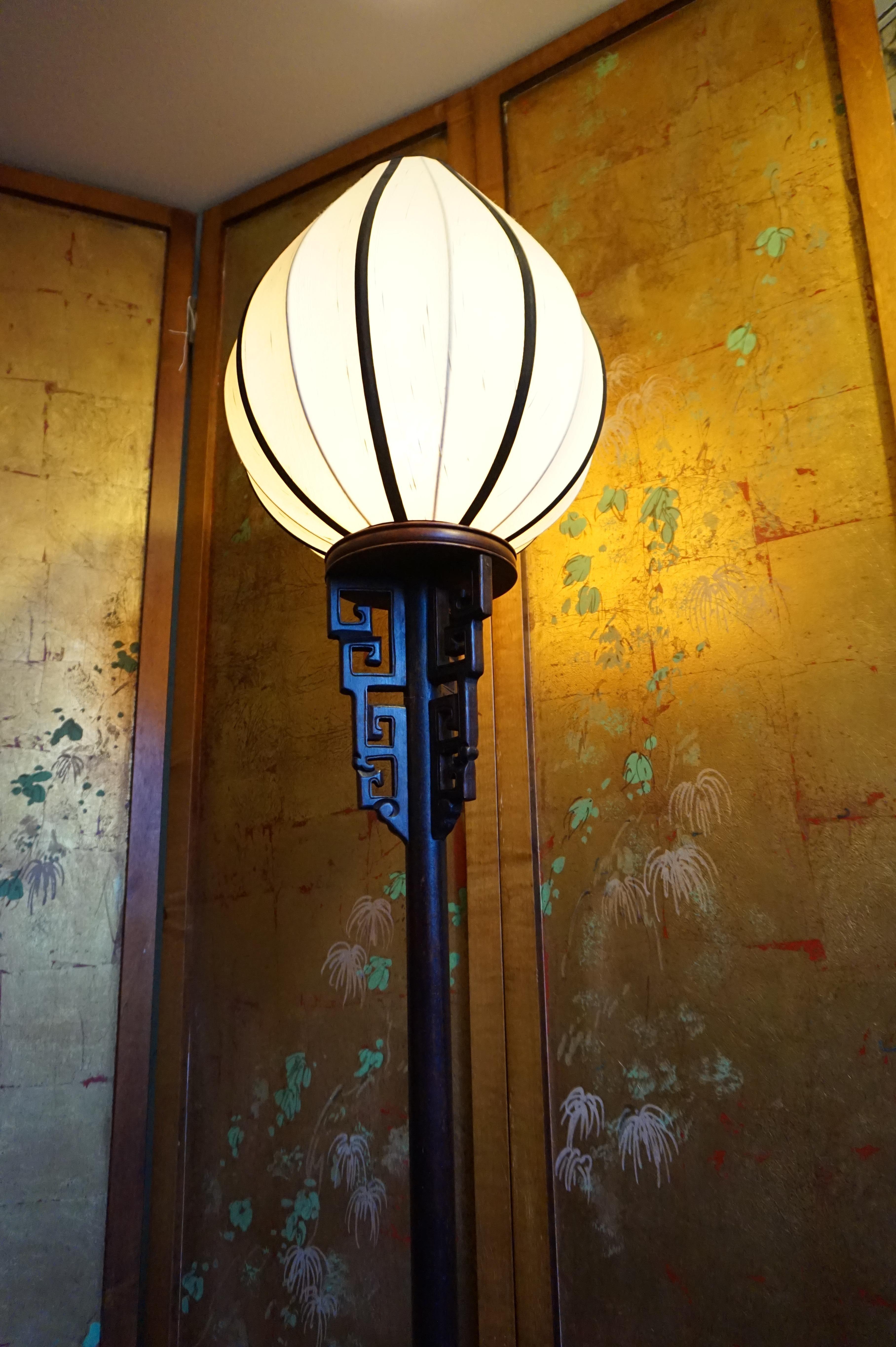 Hand carved solid wood rare Chinese torchiere lamp with custom made conical raw silk shade. One of a kind. Rewired with push button. Working well, circa 1900-1910. Likely flag post from the late Qing period converted into a lamp at some point.