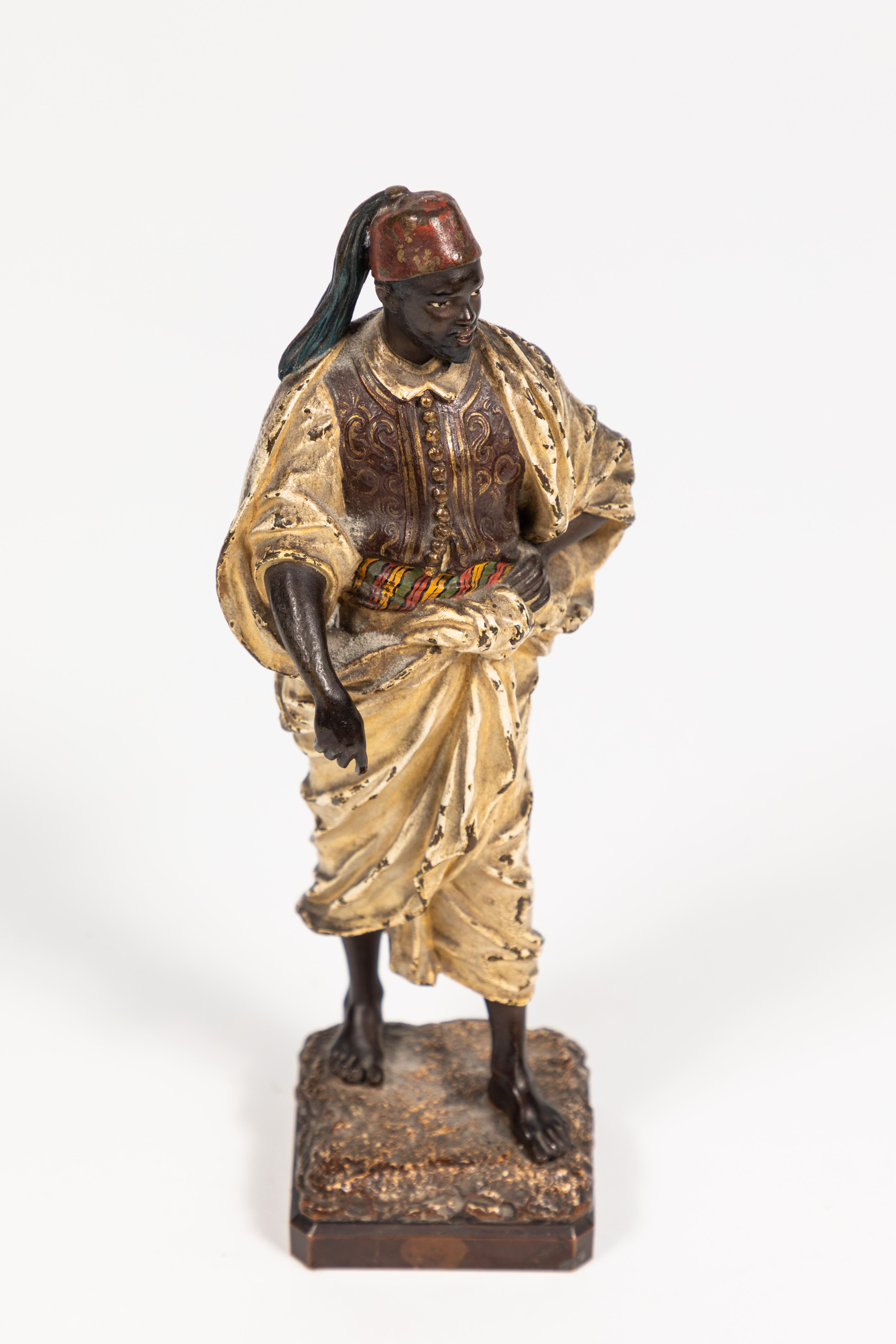 Hand painted figure of an Arab man. Early 1900s. European. Not sure of origin. Signed by artist: 
