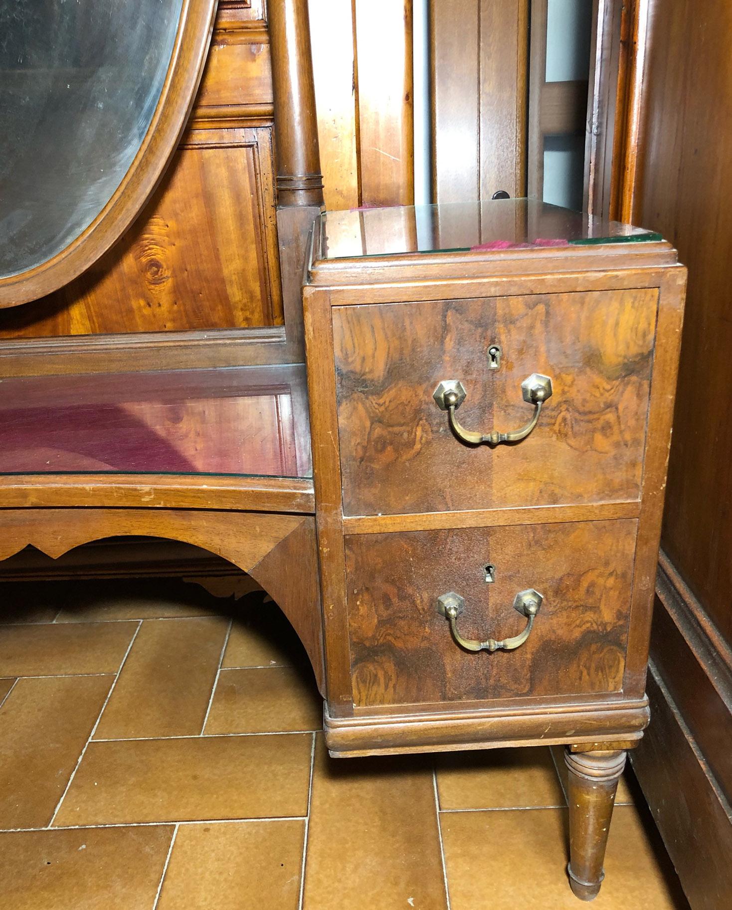 Console in walnut, with oval rotating mirror, four drawers and glass on the top.
Size cm.: 45 x 130 x 181 H.
Comes from an old country house in the Chianti area of Tuscany.
The paint is original in patina, honey amber color. 
As shown in the