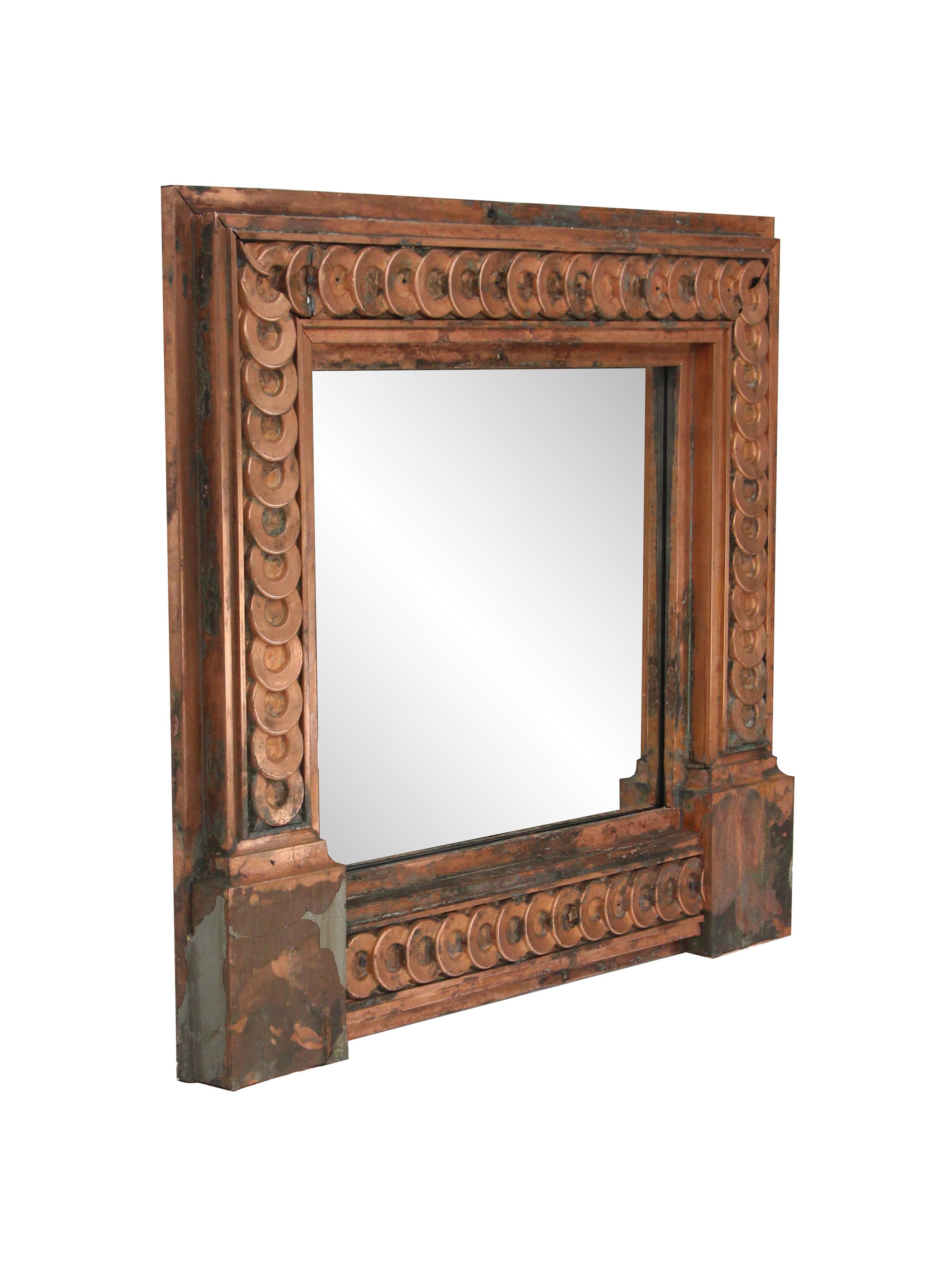 Made from the recovered copper building facade of a 1900s NYC building. New mirror and wood frame. This can be seen at our 400 Gilligan St location in Scranton, PA.
