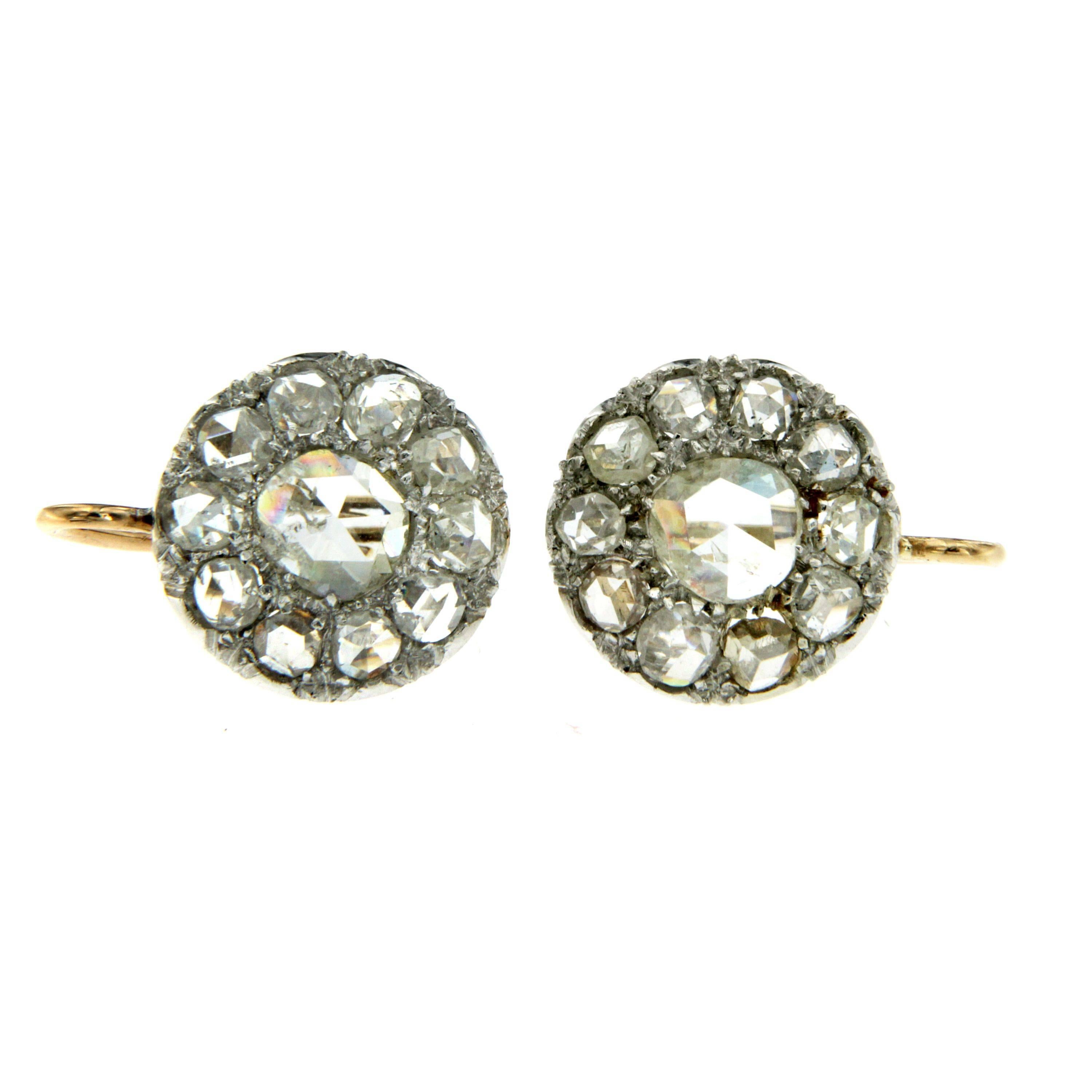 Timeless antique cluster earrings, restored, in excellent conditions.
They are hand crafted in 18k rose gold and set with approx. 0.60 ct of Sparkling Colorless and Large Rose cut Diamonds.

CONDITION: Pre-owned - Excellent 
METAL: 18k Gold
STONE: