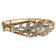 1900s Diamond, White Sapphire, Gold and Platinum Bangle Bracelet