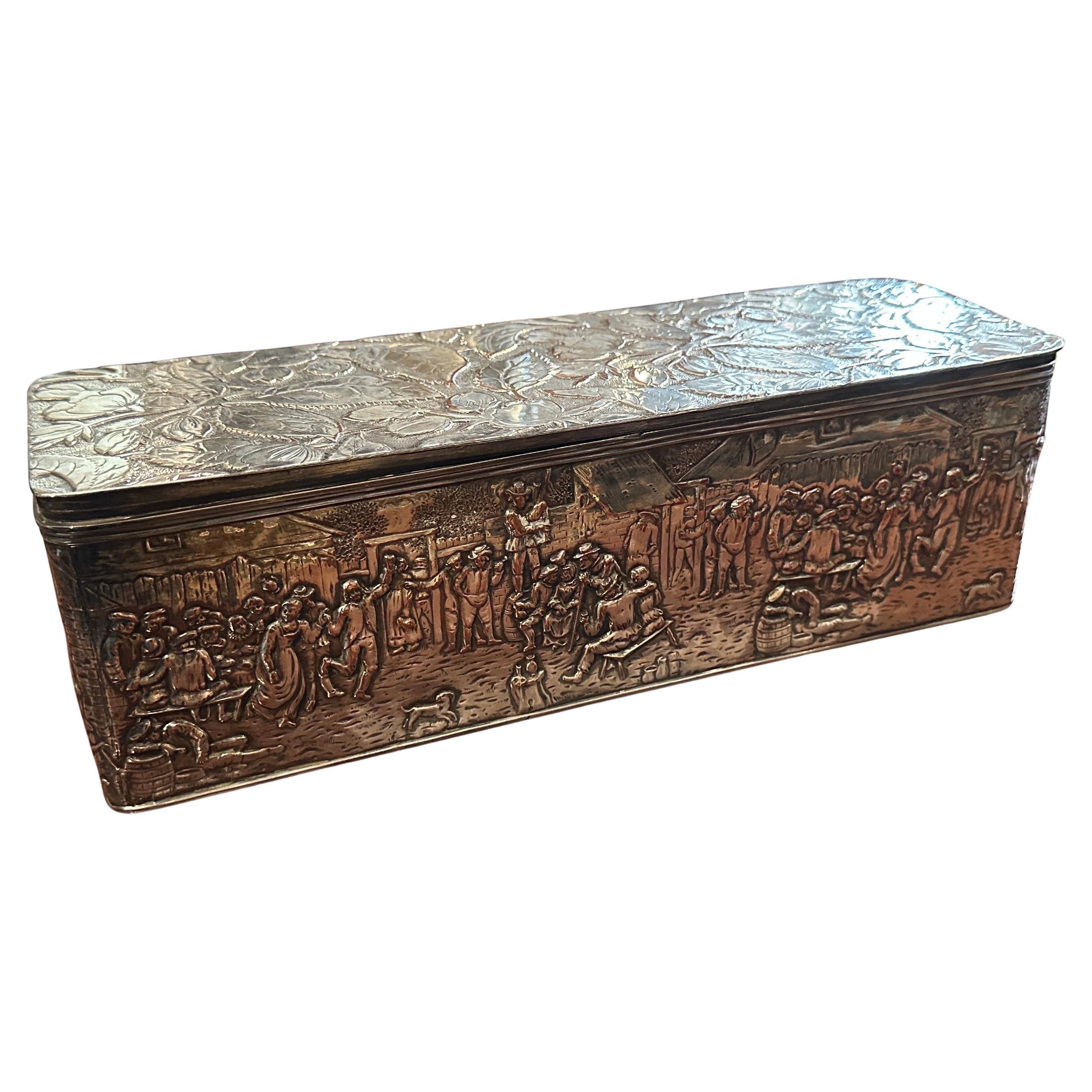This 1900s Dutch Colonial Style Copper Silver Plated American Box by Barbour & Co. is a fascinating example of decorative art from the early 20th century. Made primarily of copper, which provides a warm, rich base material.
Overlaid with silver