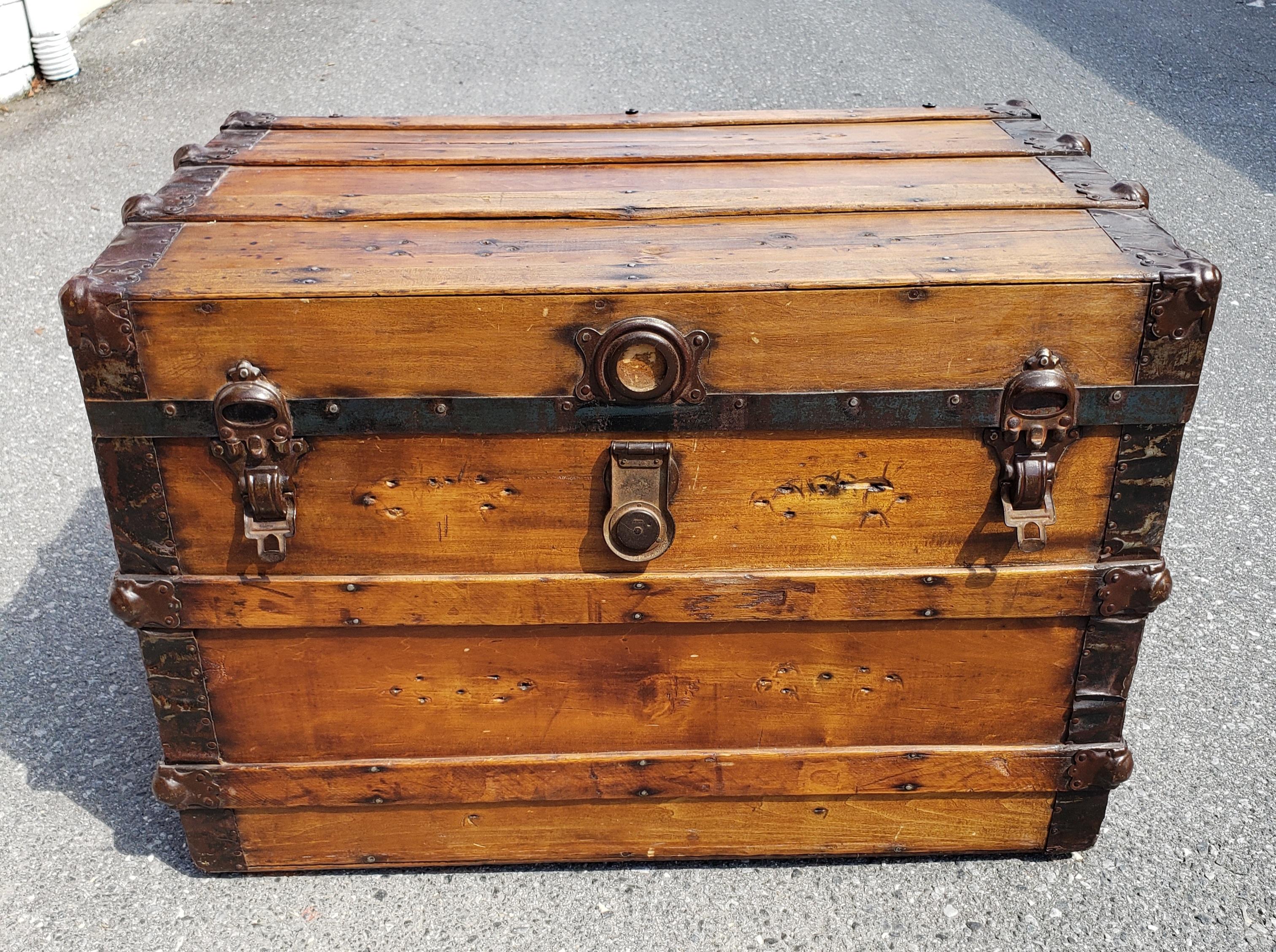 Early 20th Century American pine Blanket Trunk. Textile lined interior. Functional Leather handles.  Measures 33