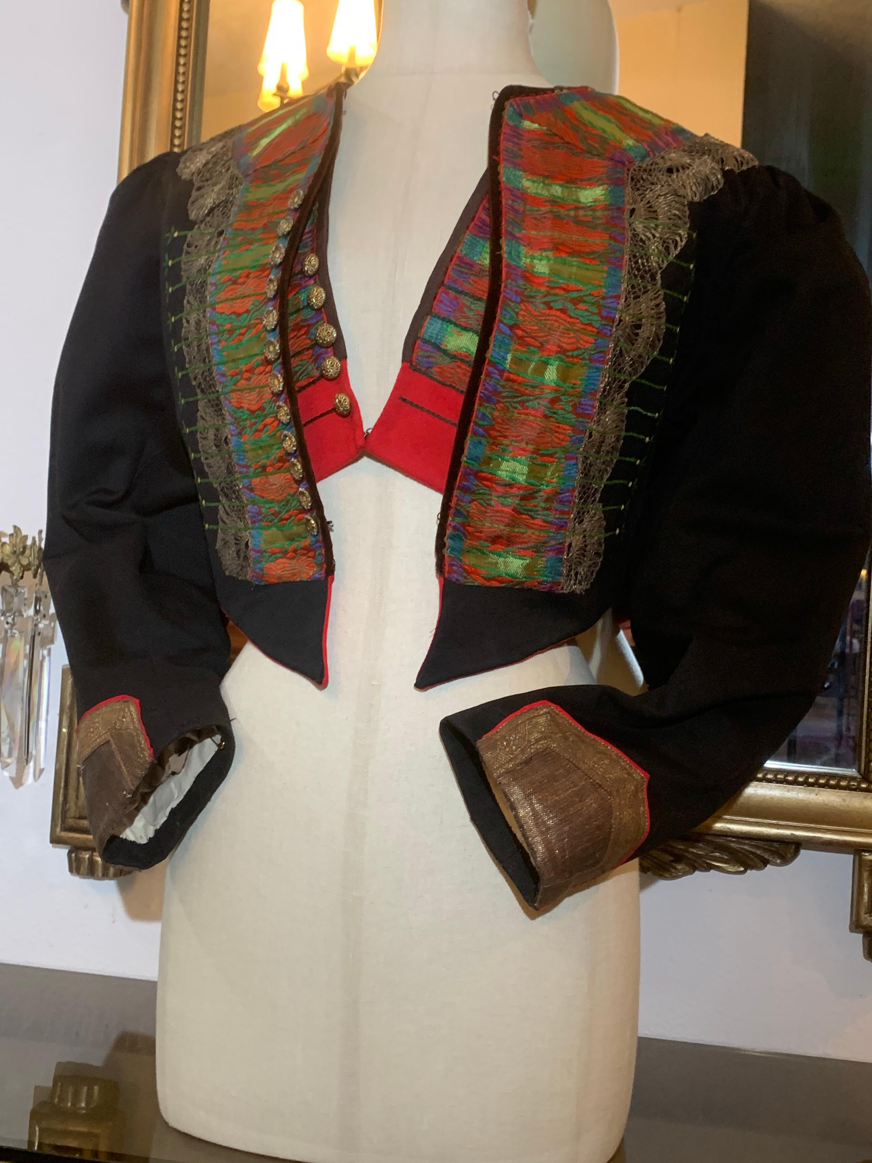1900s Eastern European Folk Wear Ensemble Delicately Embroidered Jacket & Vest :  This extraordinary genuine folkloric ensemble features exquisite detailing on a black wool felt jacket with puffed sleeves. Be sure to study the pictures to see all of