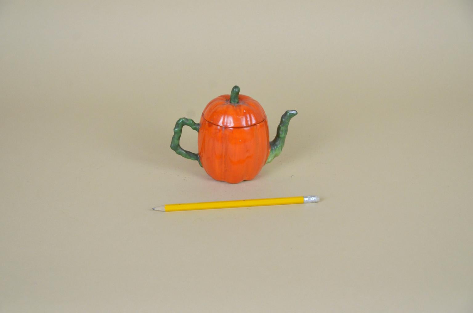 Edwardian porcelain pumpkin shaped teapot, made in England.

 