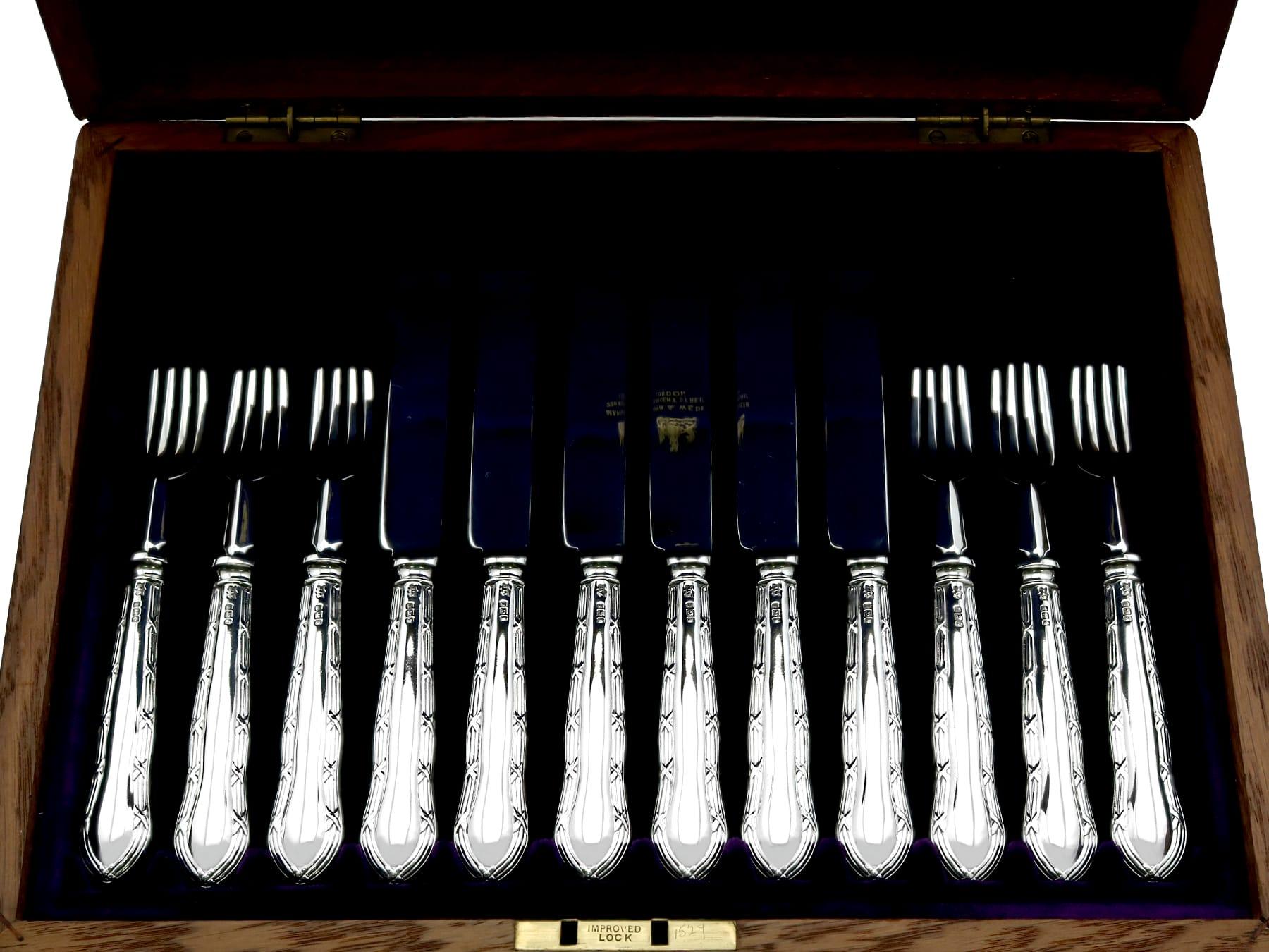 An exceptional, fine and impressive antique Edwardian English sterling silver Reed and Ribbon pattern fruit/dessert cutlery set for twelve persons made by Mappin & Webb Ltd - boxed; an addition to our dining silverware collection

This exceptional