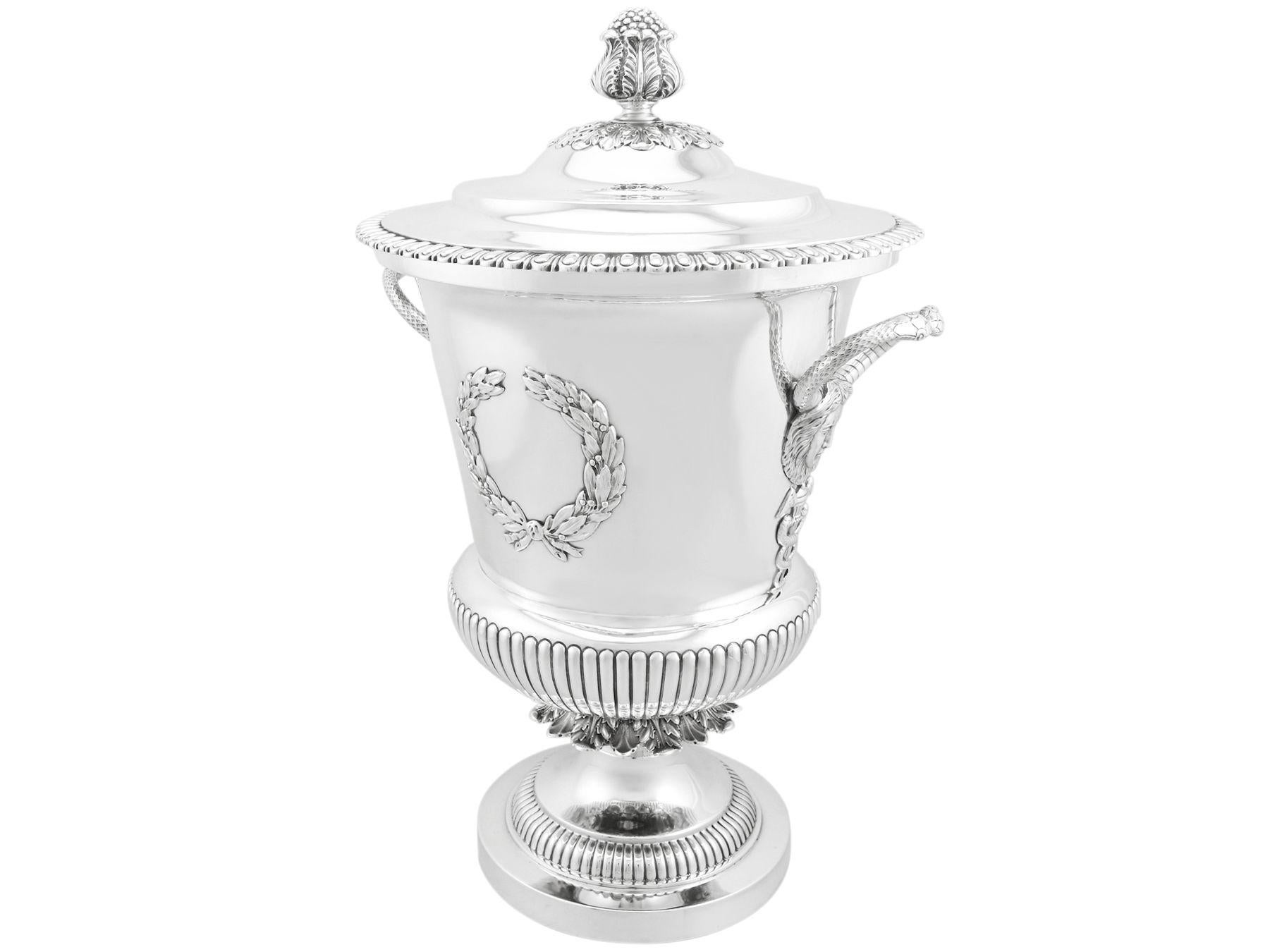 A magnificent, fine and impressive, large antique Edwardian English sterling silver cup & cover; an addition to our antique presentation silverware collection.

This magnificent and large antique Edwardian sterling silver presentation cup and