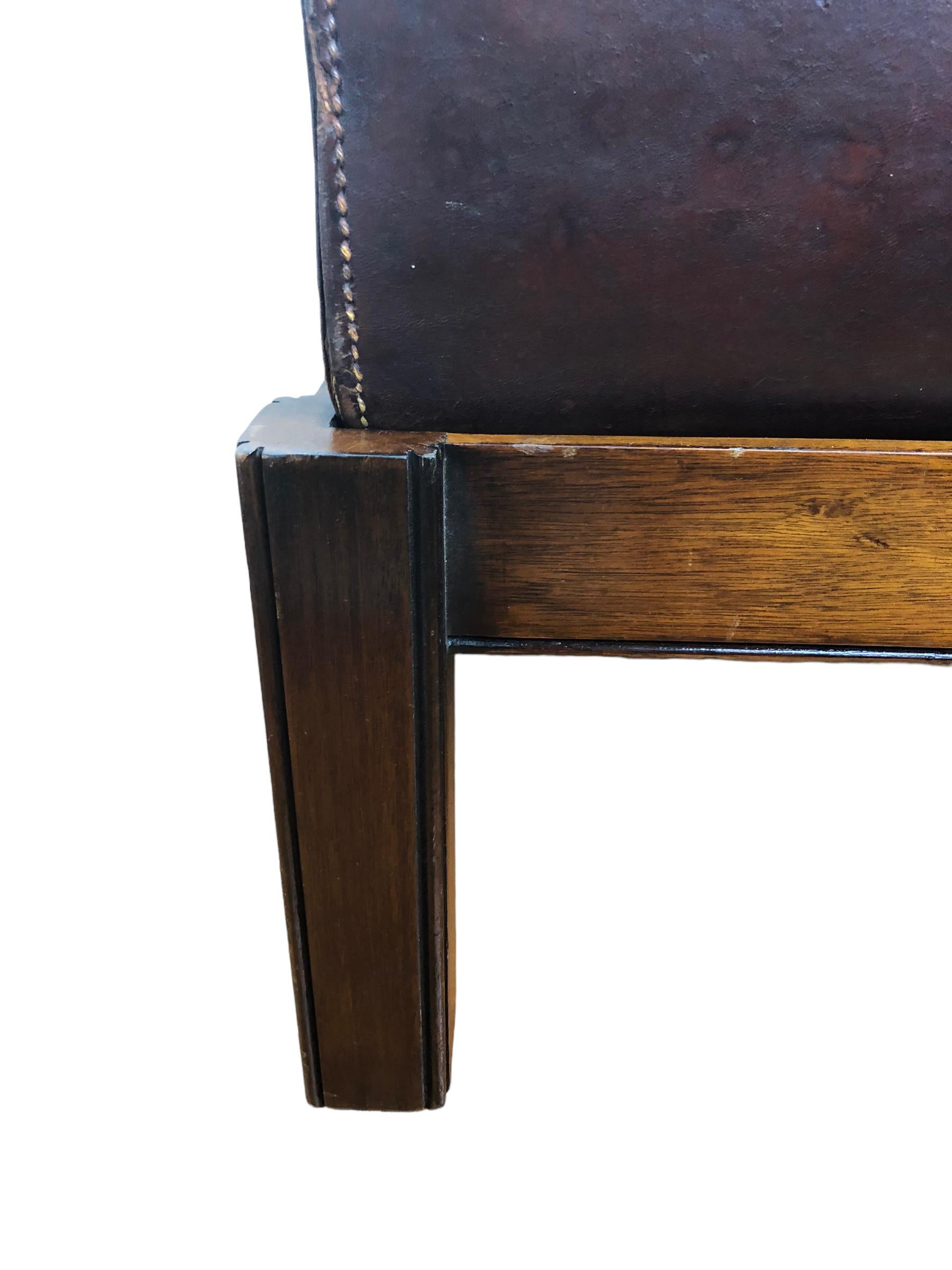 1900’s English leather box or trunk mounted on a custom mahogany frame to make a beautiful side table. Box opens to reveal plenty of room for storage. 
Wear to leather. Leather has scuffs and separation