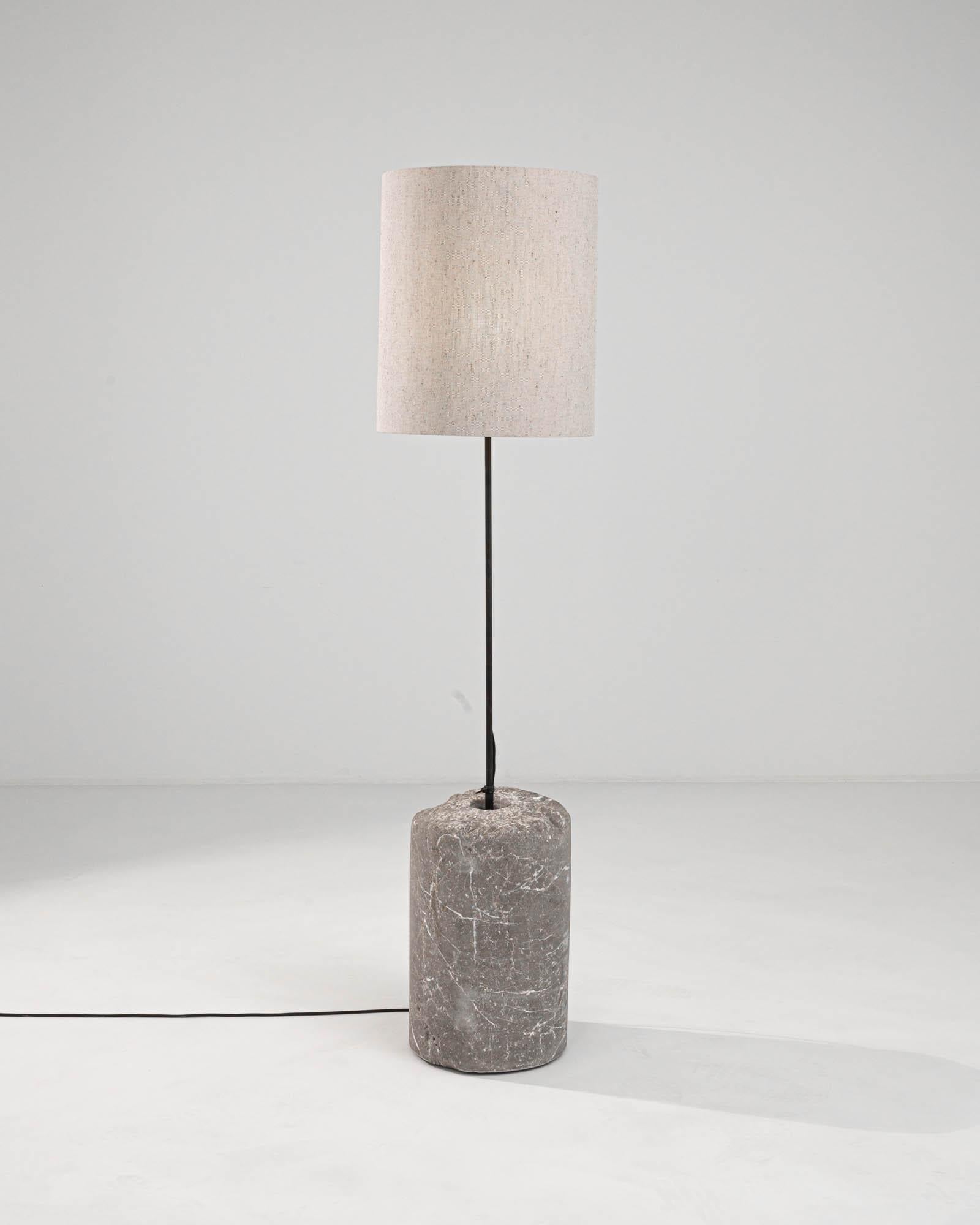 Introducing our early 1900s-inspired European Marble & Metal Floor Lamp, an elegant blend of classic charm and contemporary design. This exquisite piece features a robust, cylindrical base of genuine marble, boasting natural grey veining and