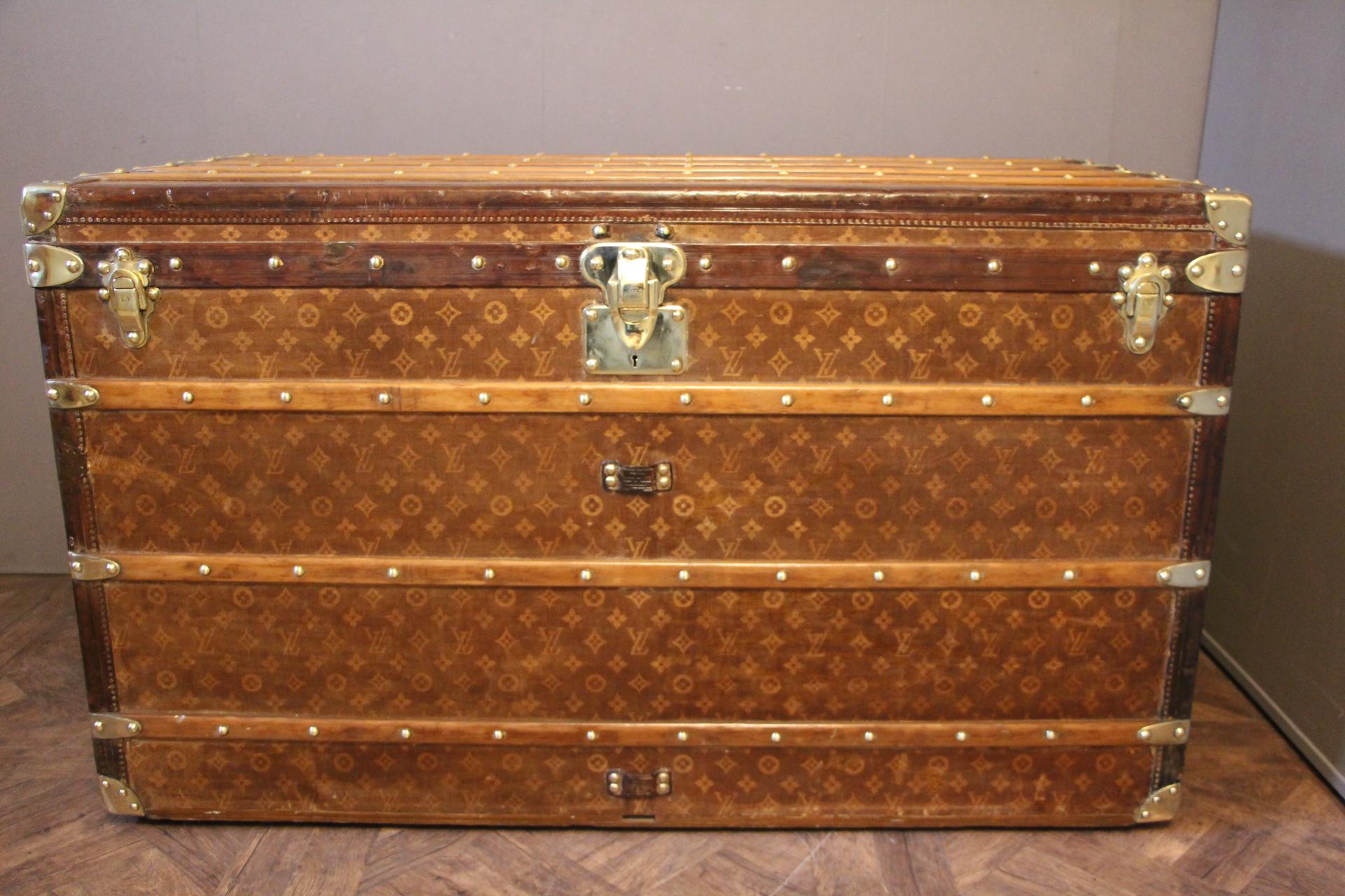 This is an unusual extra large Louis Vuitton courrier trunk featuring woven monogram canvas, leather trim, solid brass Louis Vuitton stamped locks, studs and side handles. Very unique dimensions, certainly a special order.
It has got a very warm