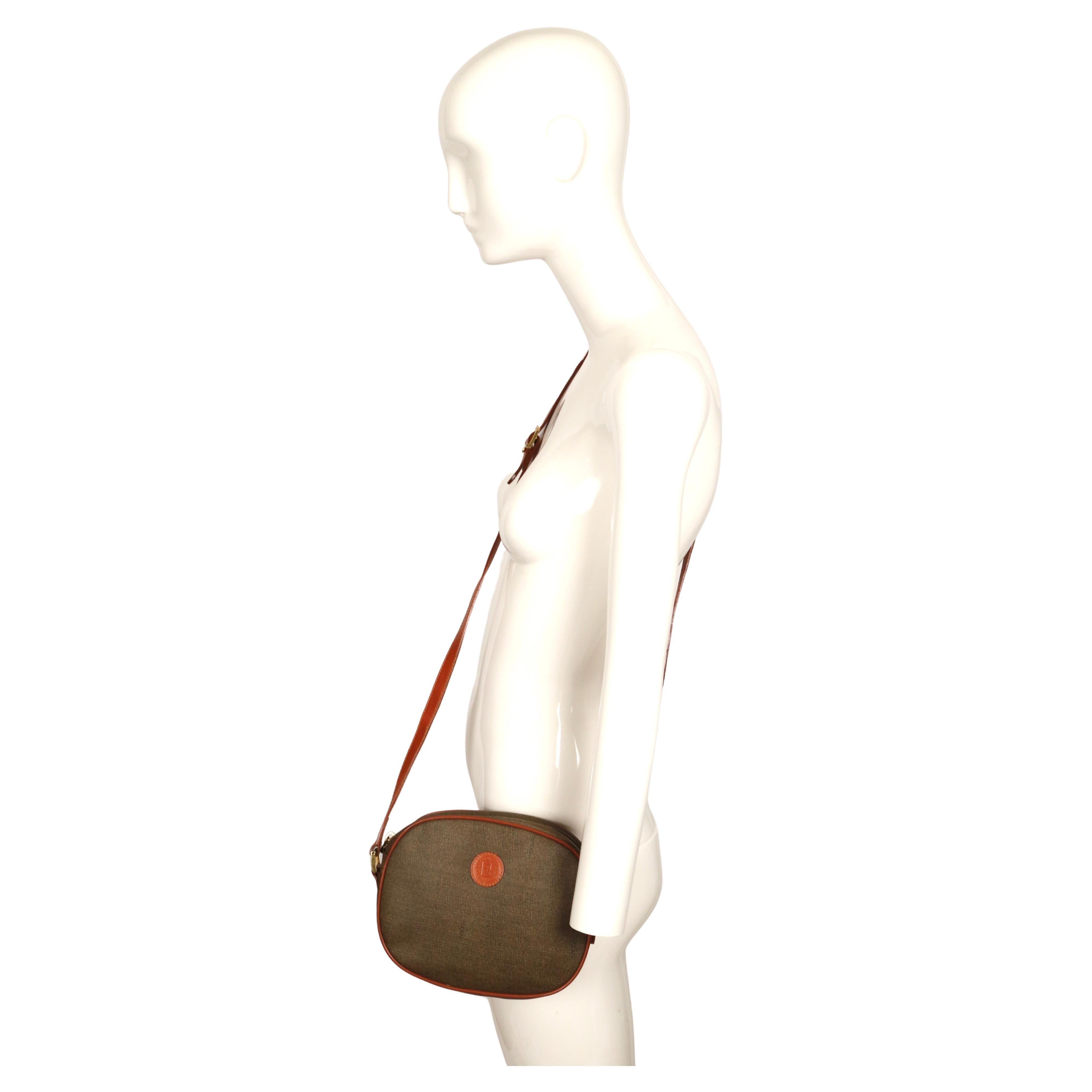 Classic coated canvas logo print bag with leather trim and gilt hardware from Fendi dating to the 1990's. Bag measures approximately: 8.5