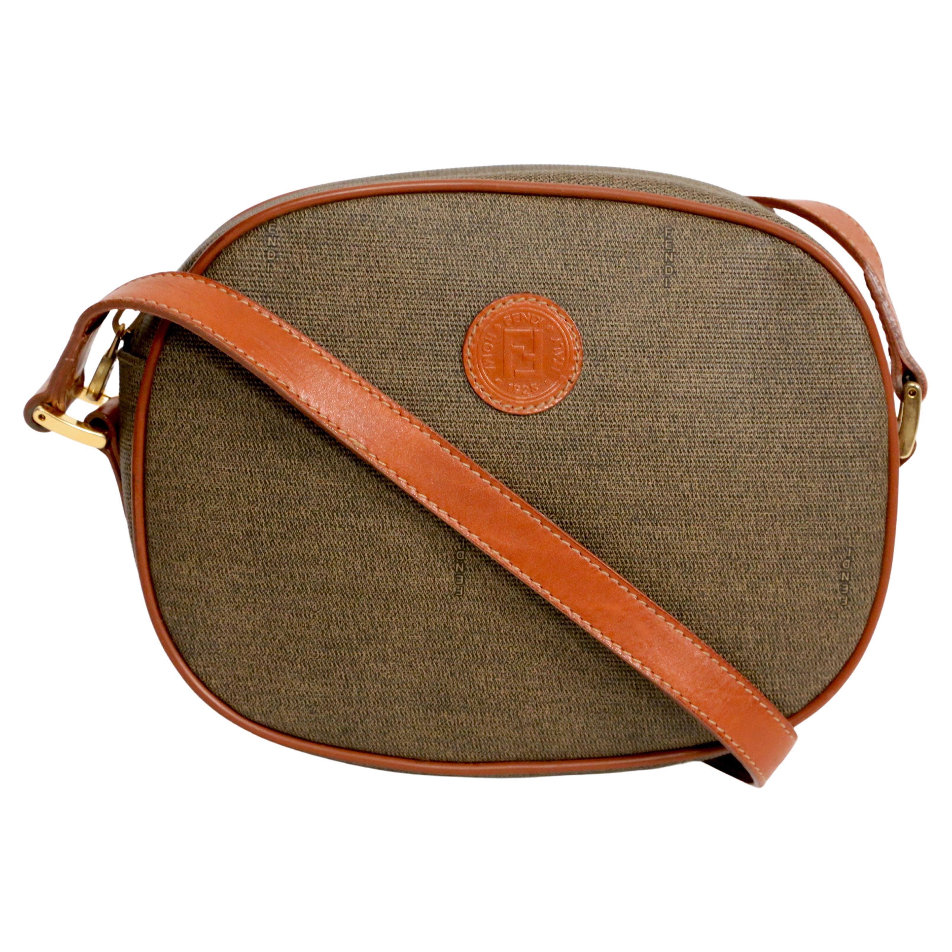 1990's FENDI oval crossbody bag with logo print and leather trim For Sale