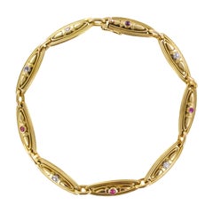 Antique 1900s French Belle Époque Ruby Diamonds 18 Karat Yellow Gold Link Bracelet