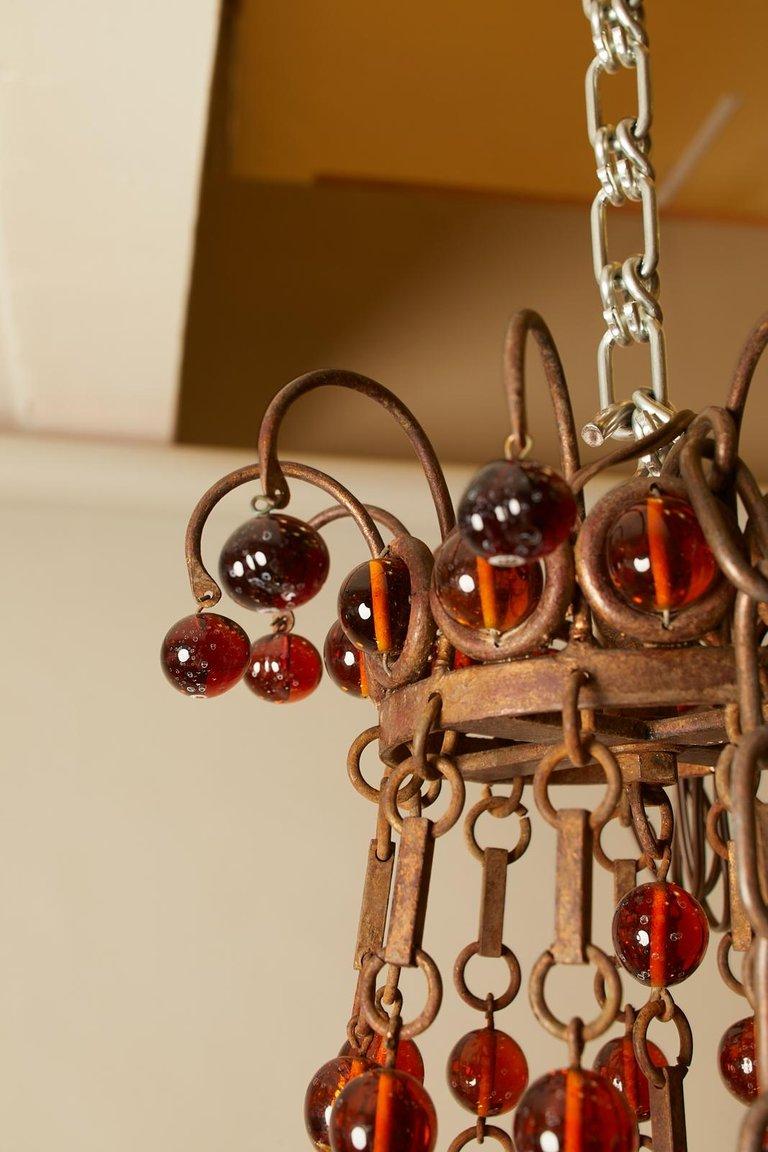 1900s French chandelier with Bohemian style, amber beads and forged metal details.